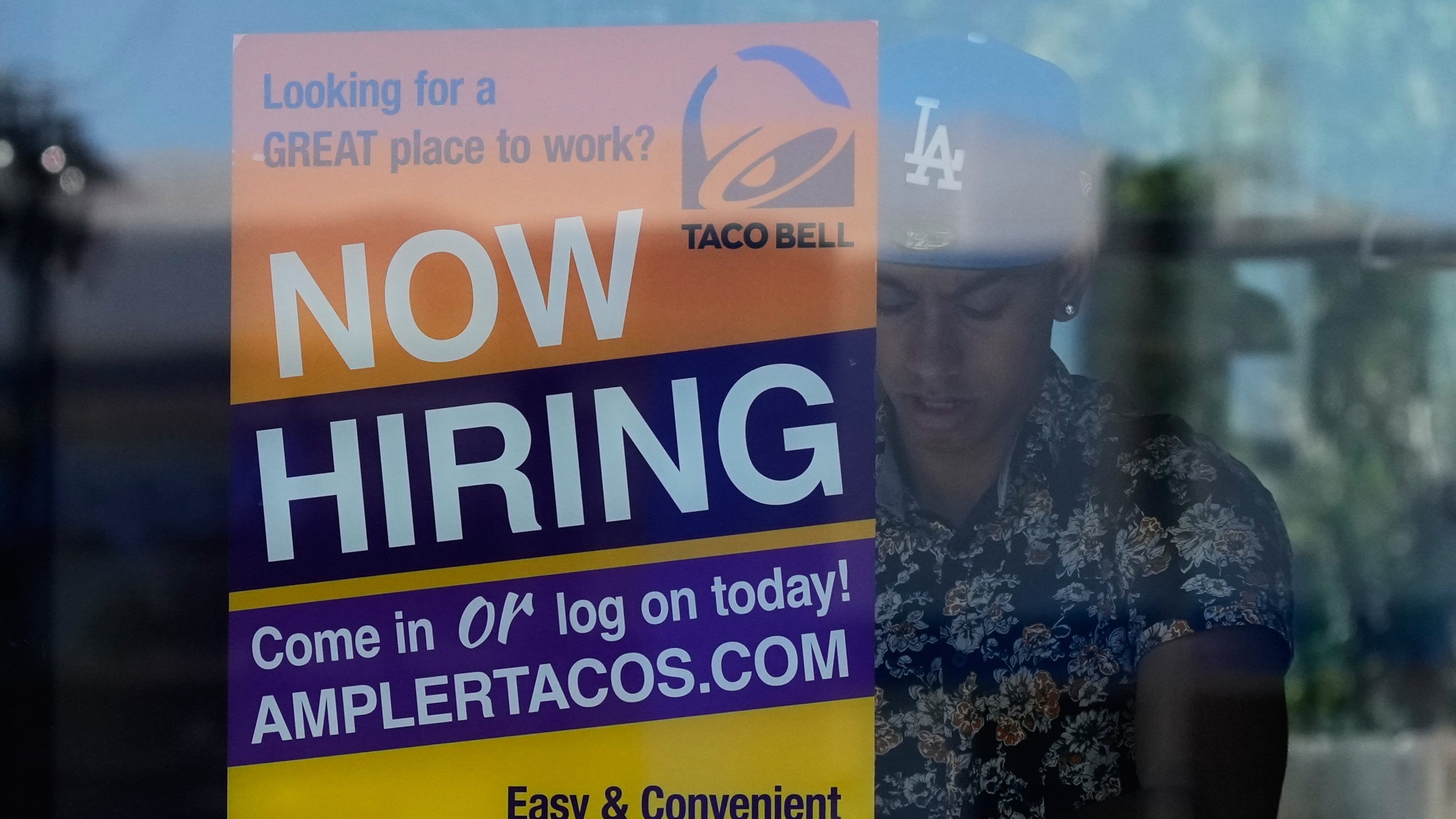 A hiring sign is displayed at a restaurant in Niles, Ill., Thursday, May 14, 2026. (AP Photo/Nam Y. Huh)