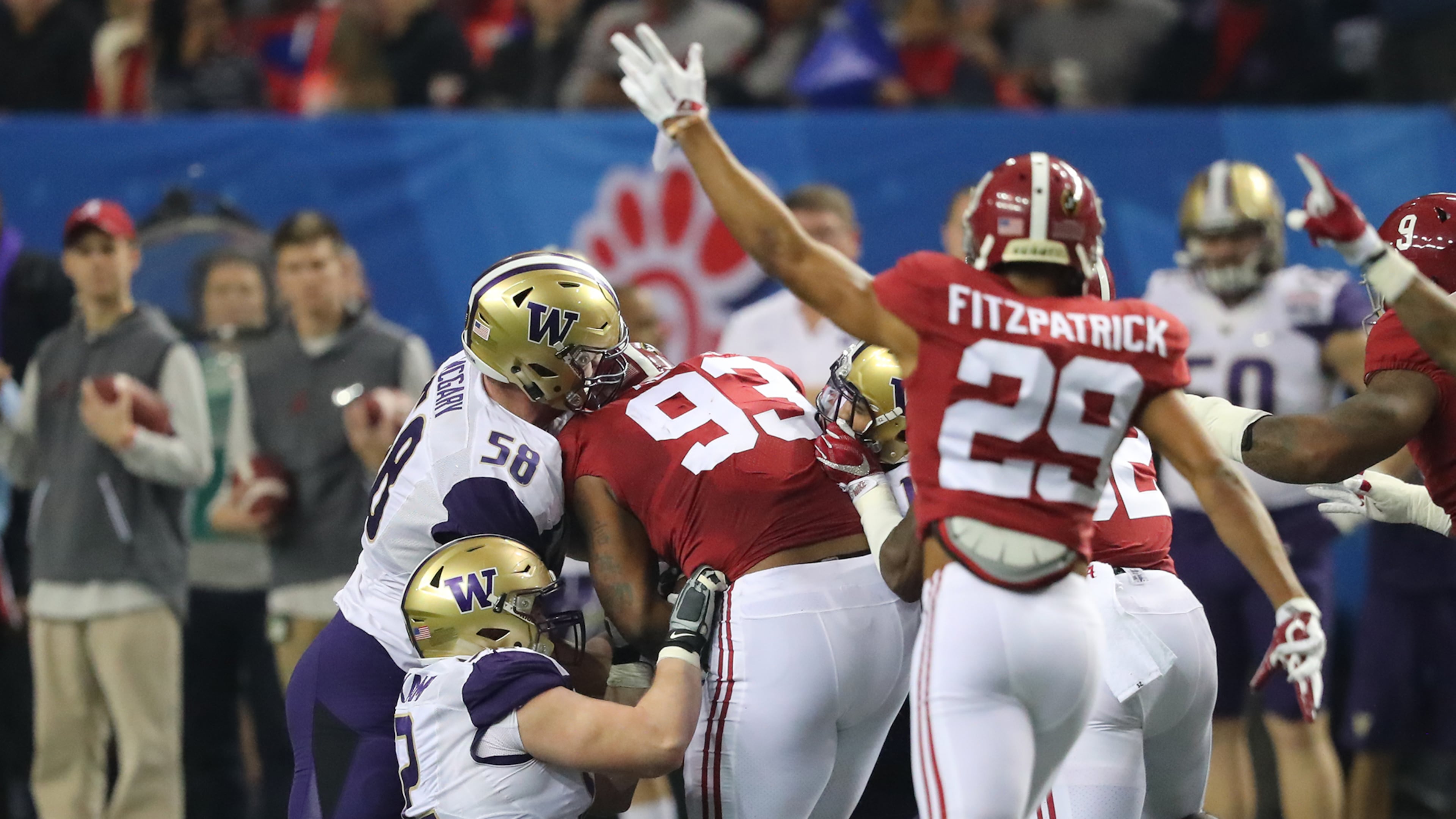 Alabama defender Jonathan Allen (left) recovers a Washington fumble during the first quarter in the Chick-fil-A Peach Bowl at the Georgia Dome on Saturday, Dec. 31, 2016, in Atlanta. Curtis Compton/ccompton@ajc.com