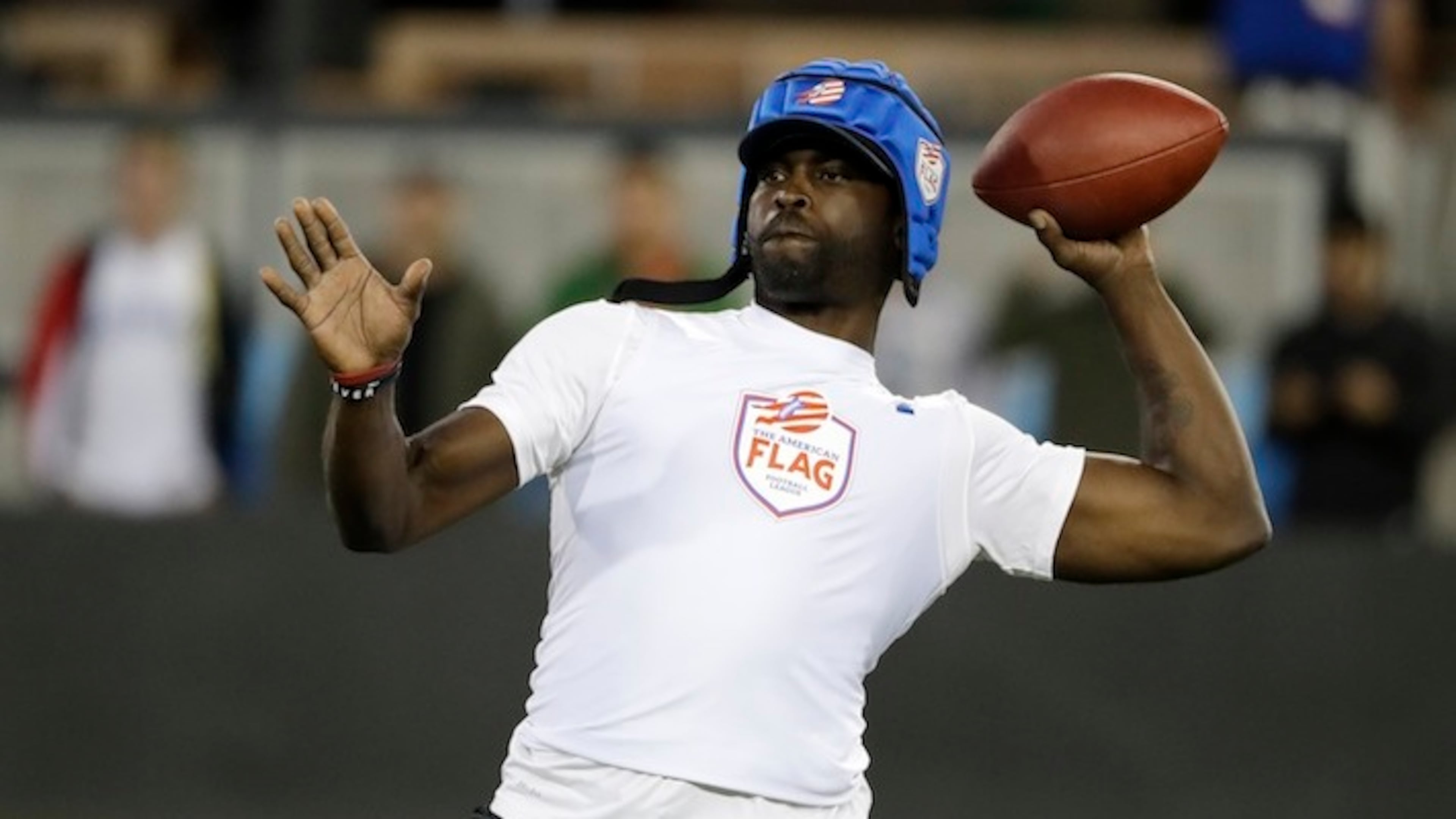 Team Vick's Michael Vick throws against Team Owens during a flag football exhibition game Tuesday, June 27, 2017, in San Jose, Calif. (AP Photo/Marcio Jose Sanchez)