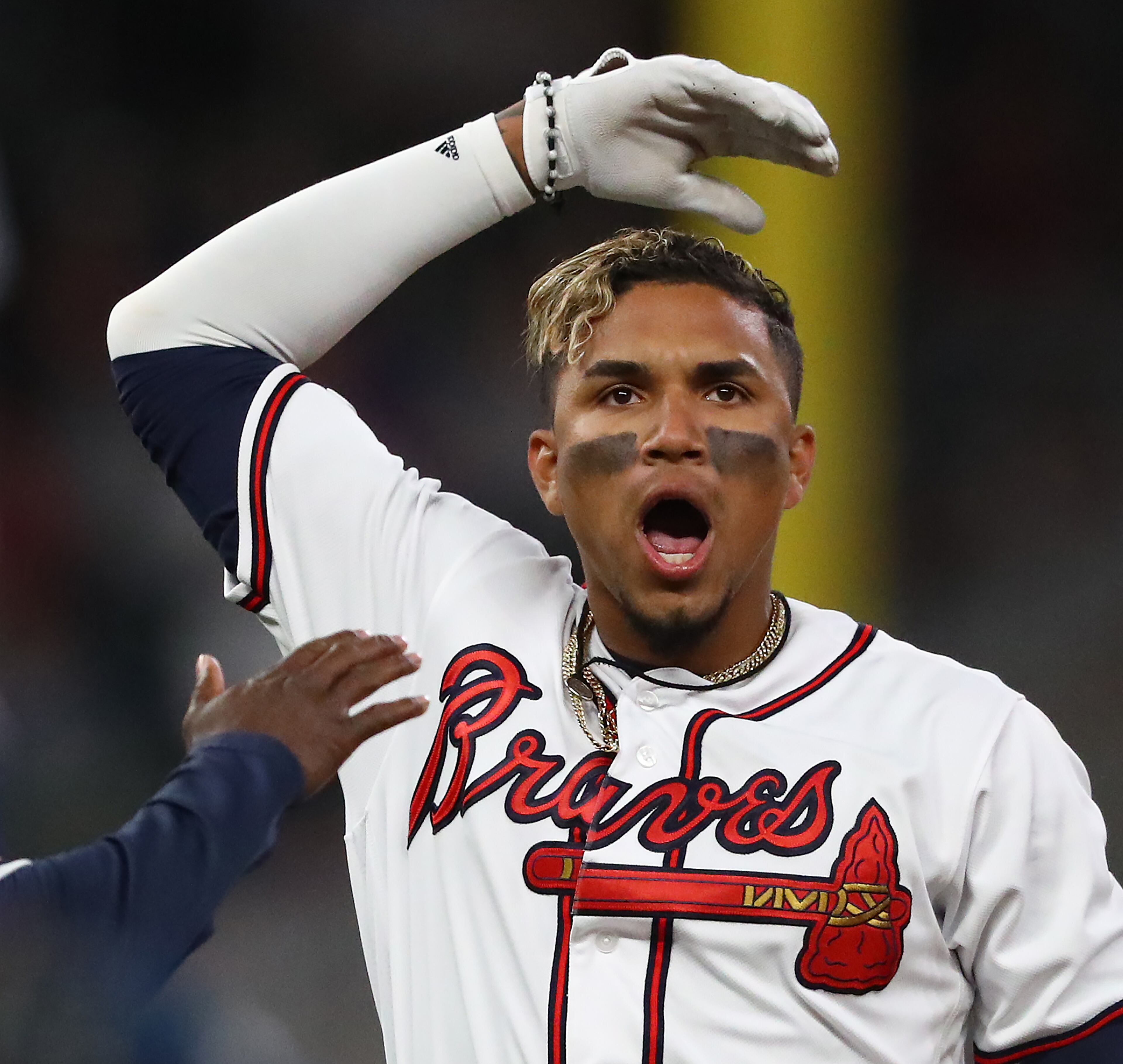 Johan Camargo fires up the fans after hitting a three-RBI double to give the Braves a 5-4 lead over the Chicago Cubs during the eighth inning Wednesday, April 3, 2019, in Atlanta. The Braves beat the Cubs 6-4. Curtis Compton/ccompton@ajc.com
