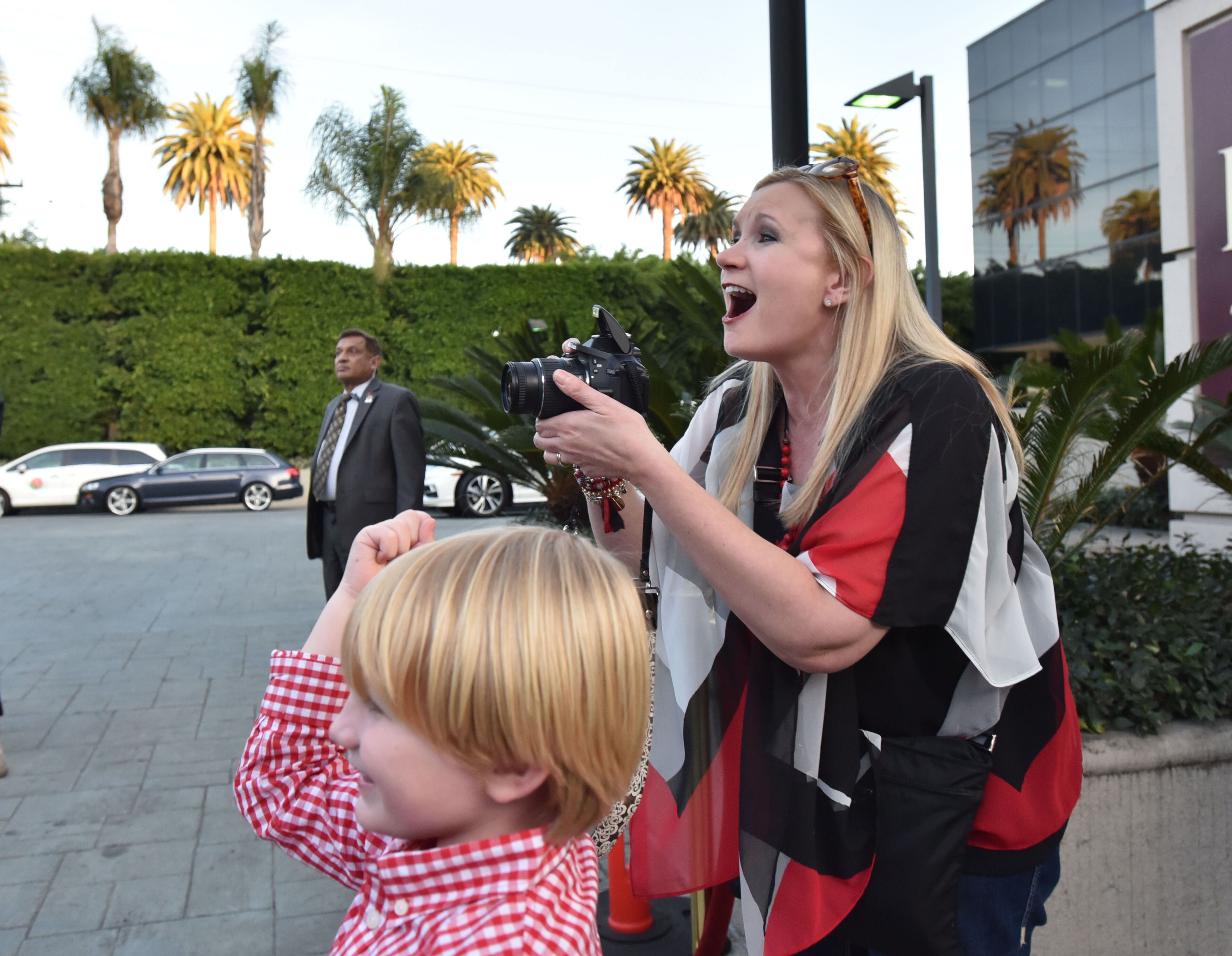 Tricia Hise of Cornelia, Ga., and her son Max, 6, were excited to see the team pull up to the Lawry's Beef Bowl. AJC photo: Hyosub Shin / hshin@ajc.com