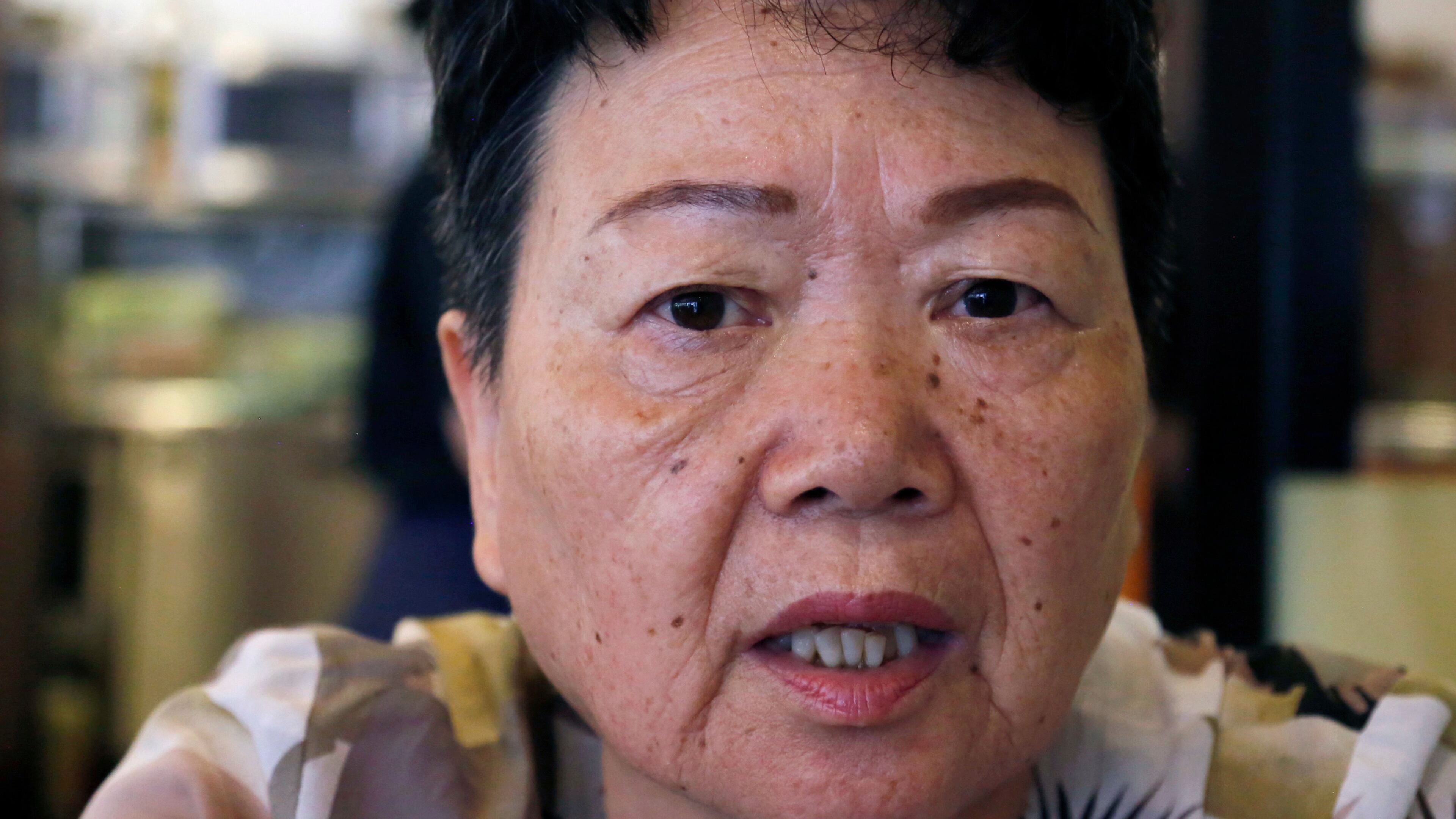 FILE - Eiko Kawasaki, a Korean born in Japan, speaks during an interview in Tokyo Friday, Aug. 24, 2018. (AP Photo/Yuri Kageyama, file)