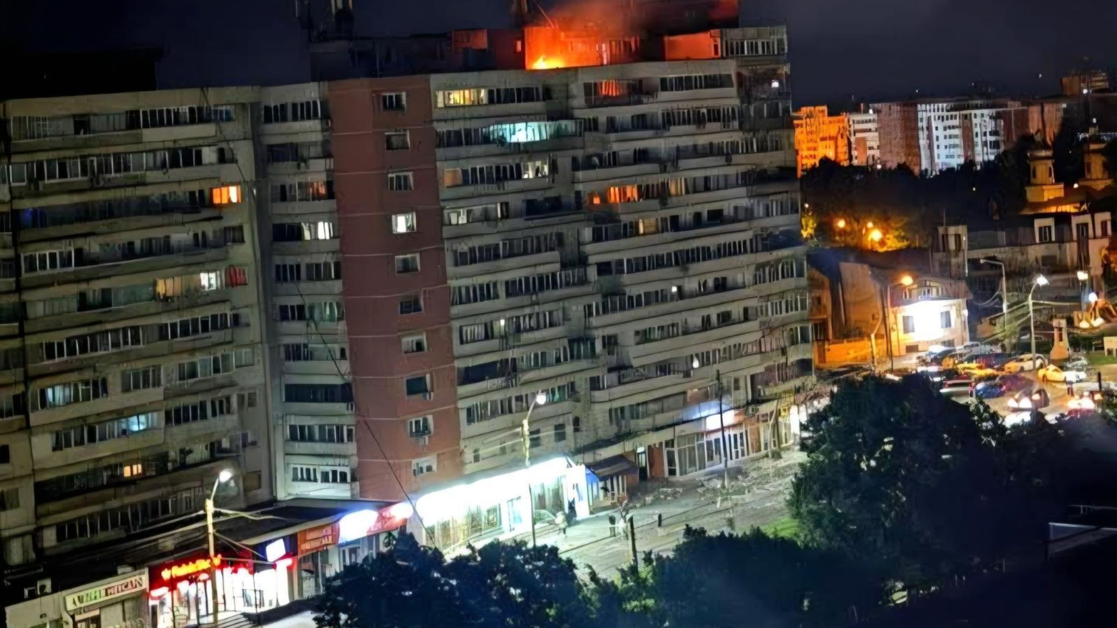 This photo released by Romania's Department for Emergency Situations shows a fire on top of a block of flats after a drone crash caused an explosion and fire on impact, in Galati, eastern Romania near the Ukrainian border, Friday May 29, 2026. (ISU Galati via AP)