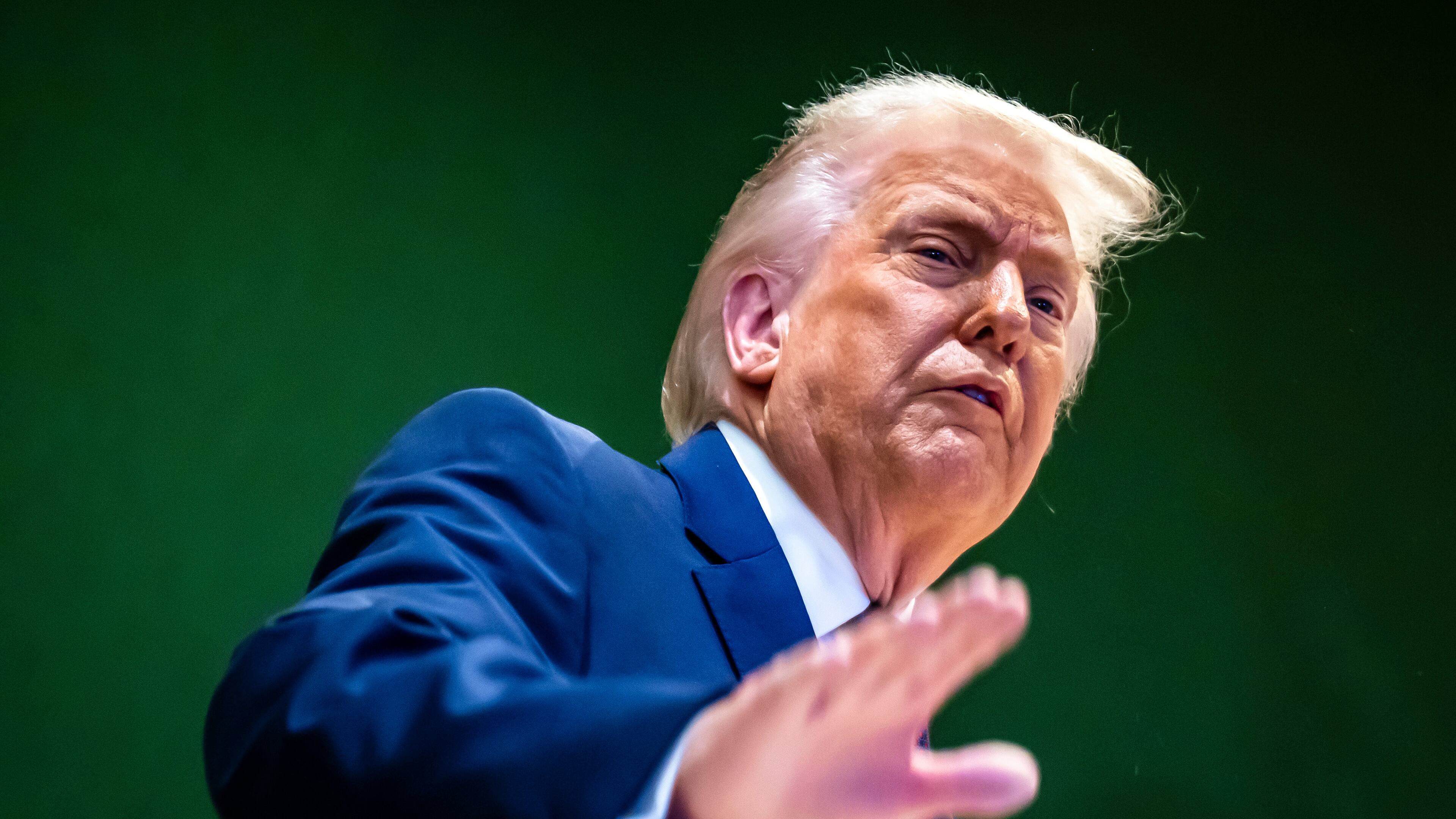 U.S. President Donald Trump gestures as he climbs a staircase after a signing ceremony of his Board of Peace initiative at the Annual Meeting of the World Economic Forum in Davos, Switzerland, Thursday, Jan. 22, 2026. (Laurent Gillieron/Keystone via AP)