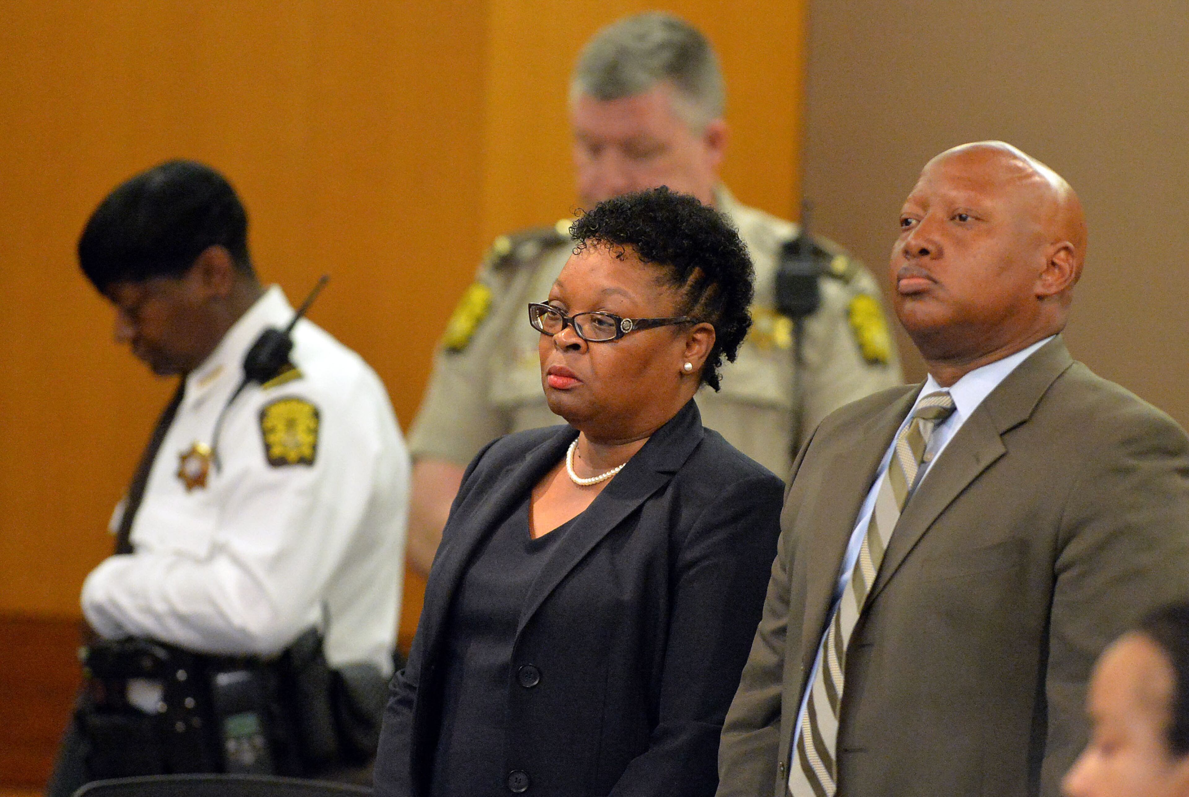 Former APS Dunbar Elementary teacher Diane Buckner-Webb stands with her defense attorney Kevin Franks as she hears the verdict convicting her of Violation of Racketeer Influenced and Corrupt Organizations Act charges Wednesday. A jury of six men and six women render convicted 11 of 12 defendants on RICO and other assorted charges on their eighth day of deliberations in the Atlanta Public Schools test-cheating trial on Wednesday, April 1, 2015. Jurors sorted through roughly five months of testimony against 12 former educators accused of engaging in a racketeering conspiracy to inflate test scores. (Atlanta Journal-Constitution, Kent D. Johnson, Pool)