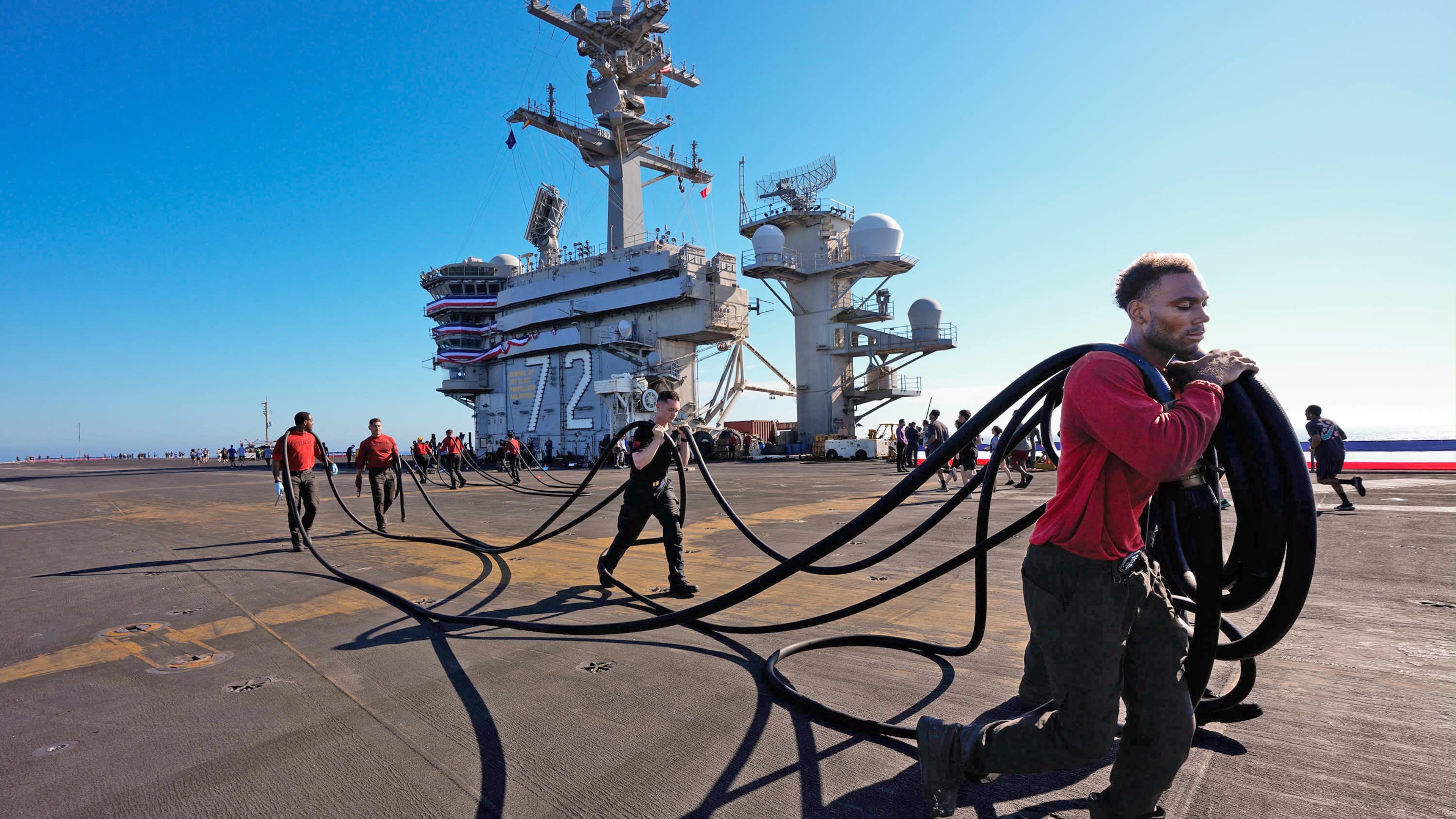 Crew members prepare the U.S.S. Abraham Lincoln (CVN 72) for return on Wednesday, Oct. 7, 2026, to her home port Naval Air Station North Island in San Diego, Calif. (Nelvin C. Cepeda/The San Diego Union-Tribune via AP)