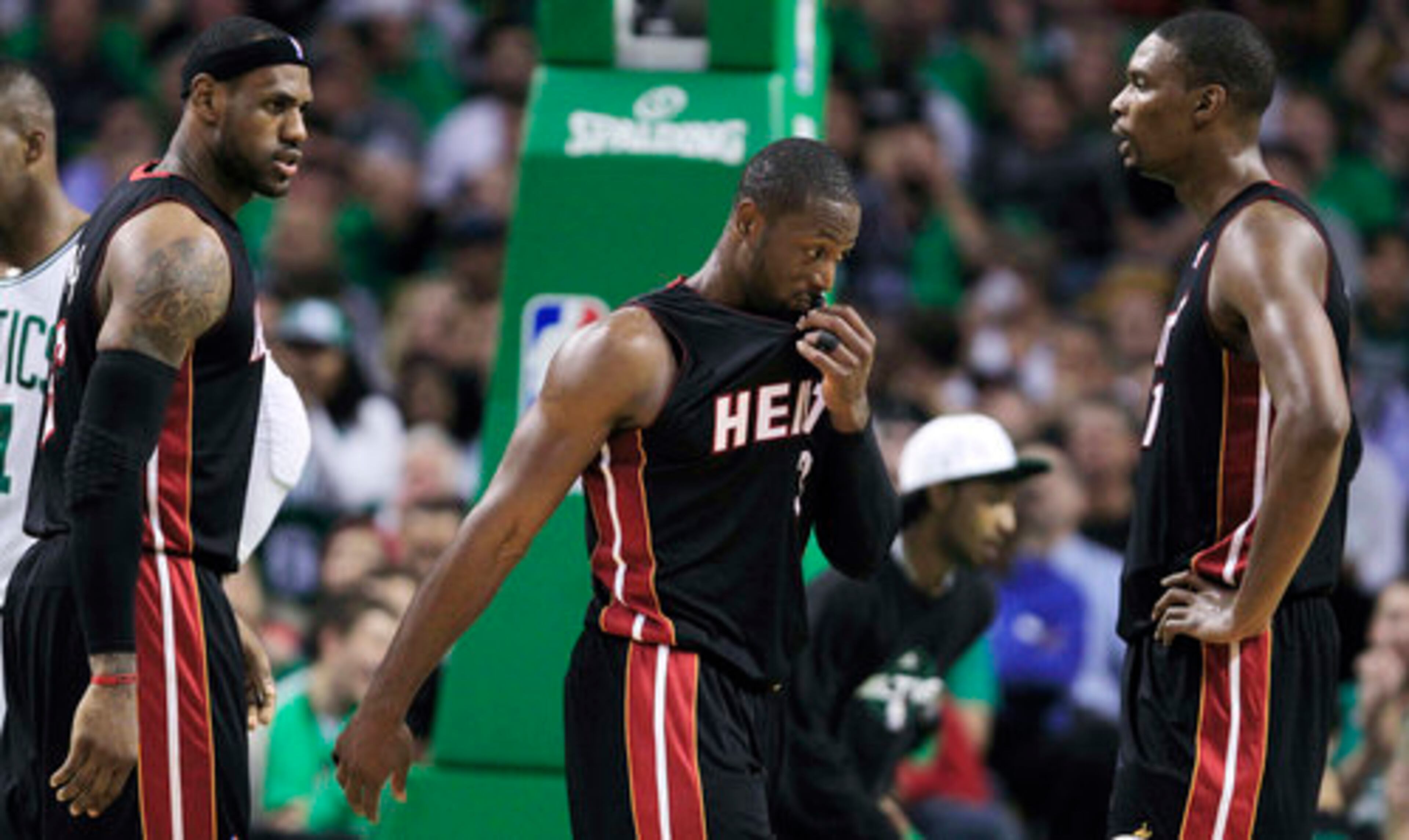 The Heat's big three -- James, Wade and Bosh -- try to motivate one another during the first half. Miami only had 9 points in the first quarter and trailed by 15 at the half.
