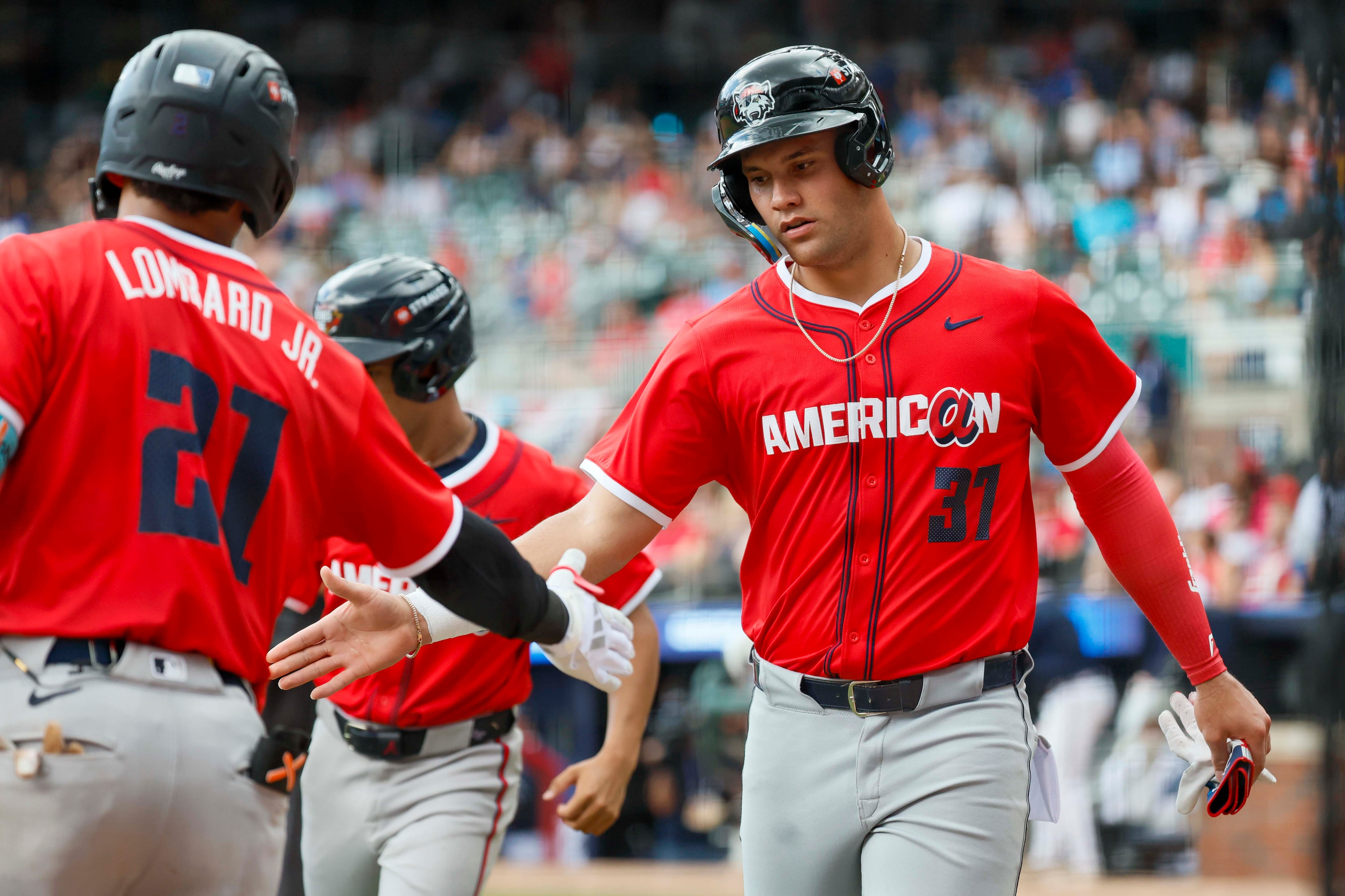 American League catcher Josue Briceno (37) of the Detroit Tigers high fives American League teammate infielder George Lombard Jr. after his run during the MLB All-Star Futures Game at Truist Park on Saturday, July 12, 2025, in Atlanta.
(Miguel Martinez/ AJC)