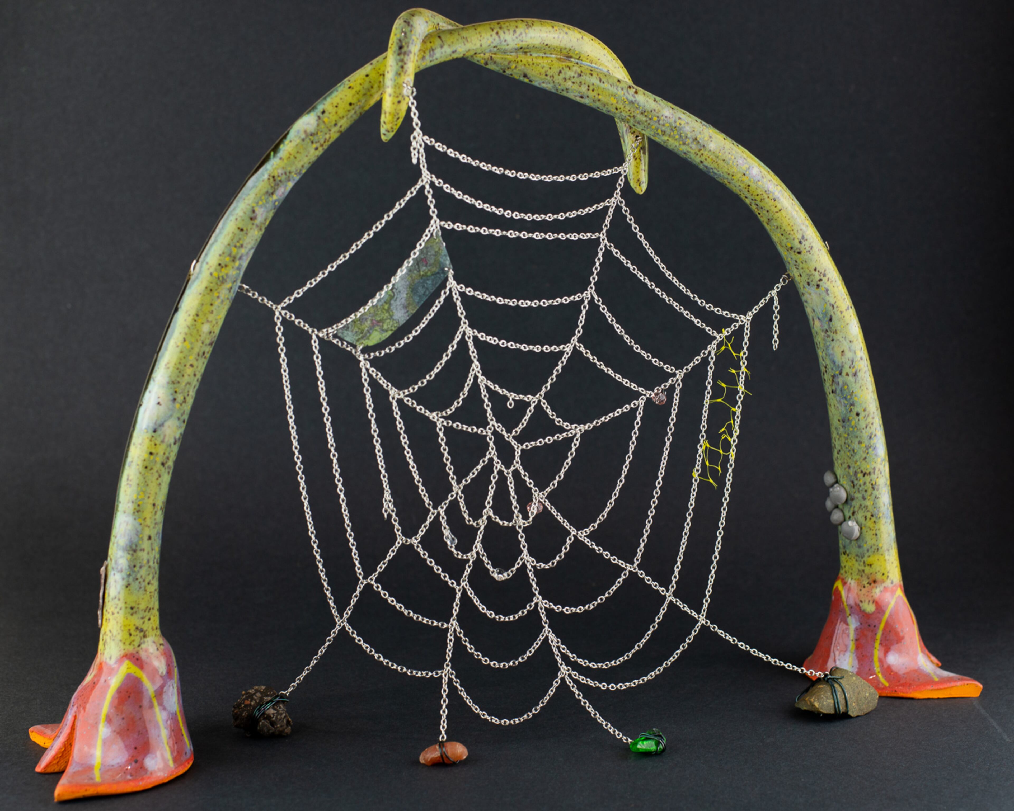 "A blood-full lily bulges over mountain massifs and valleys" in speckled stoneware and glaze, rock, asphalt, sea glass, aluminum chain, plastic beads, hand-colored transparency, wire, plastic netting, scales, sticker by Emily Llamazales is featured at Day and Night Projects.
(Courtesy of Day and Night Projects)