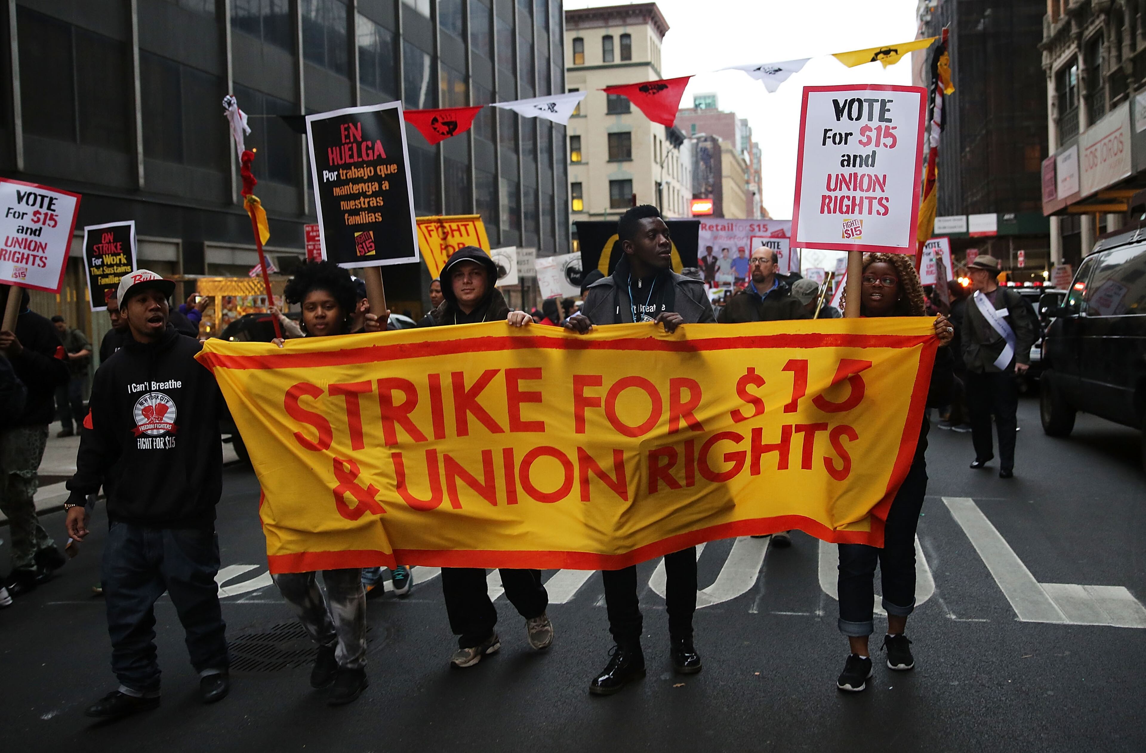 NEW YORK, NY - NOVEMBER 10: Low wage workers and supporters protest for a $15 an hour minimum wage on November 10, 2015 in New York, United States. In what organizers are calling a National Day of Action for $15 and hour minimum wage, thousands of people took to the streets across the country to stage protests in front of businesses that are paying some of their workers the minimum wage. Home care workers, employees in retail and fast food restaurants say that the current minimum is not a living wage. (Photo by Spencer Platt/Getty Images)