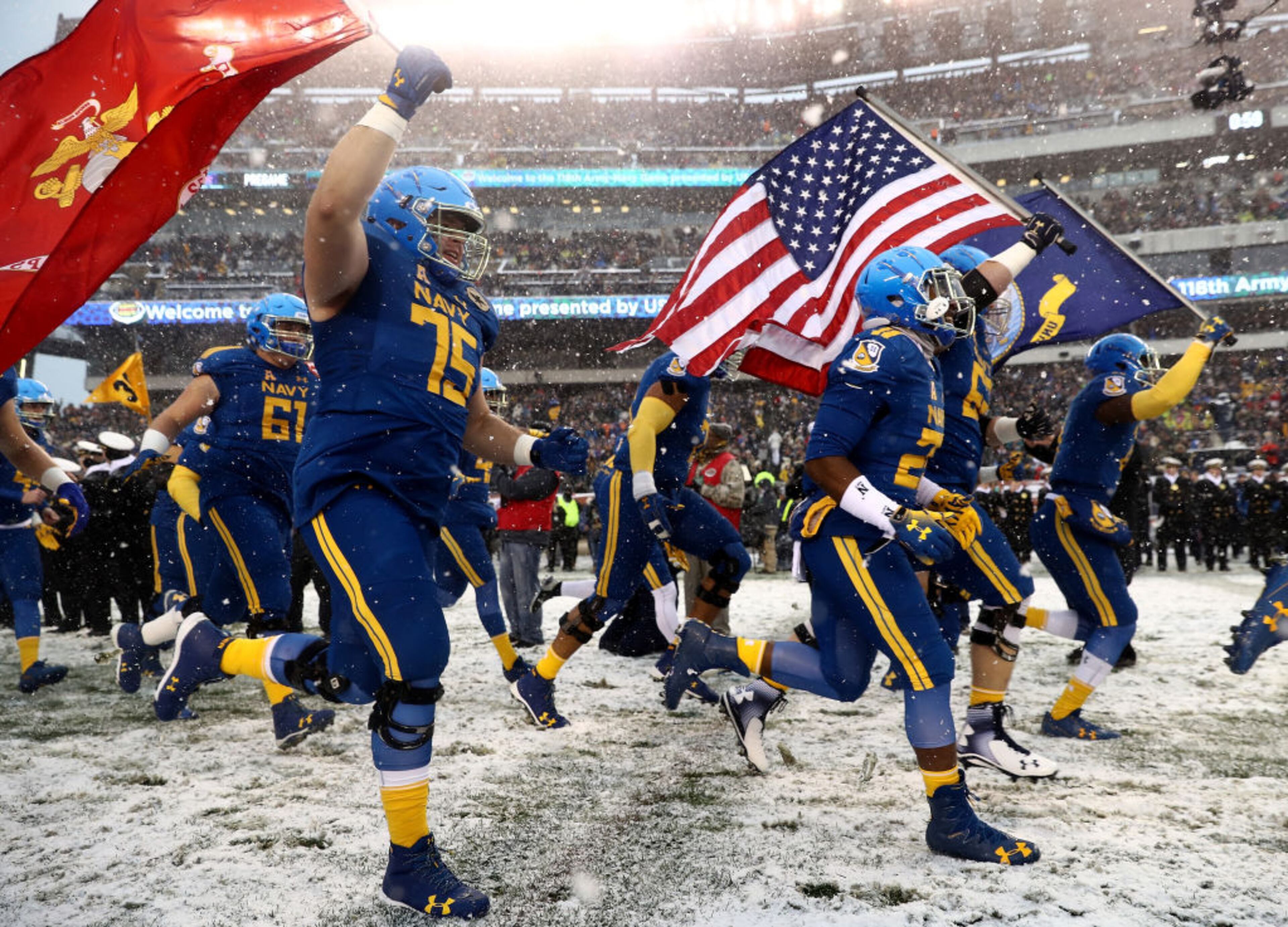 PHILADELPHIA, PA - DECEMBER 09: The Navy Midshipmen run out on the field before the game against the Army Black Knights on December 9, 2017 at Lincoln Financial Field in Philadelphia, Pennsylvania. (Photo by Elsa/Getty Images)
