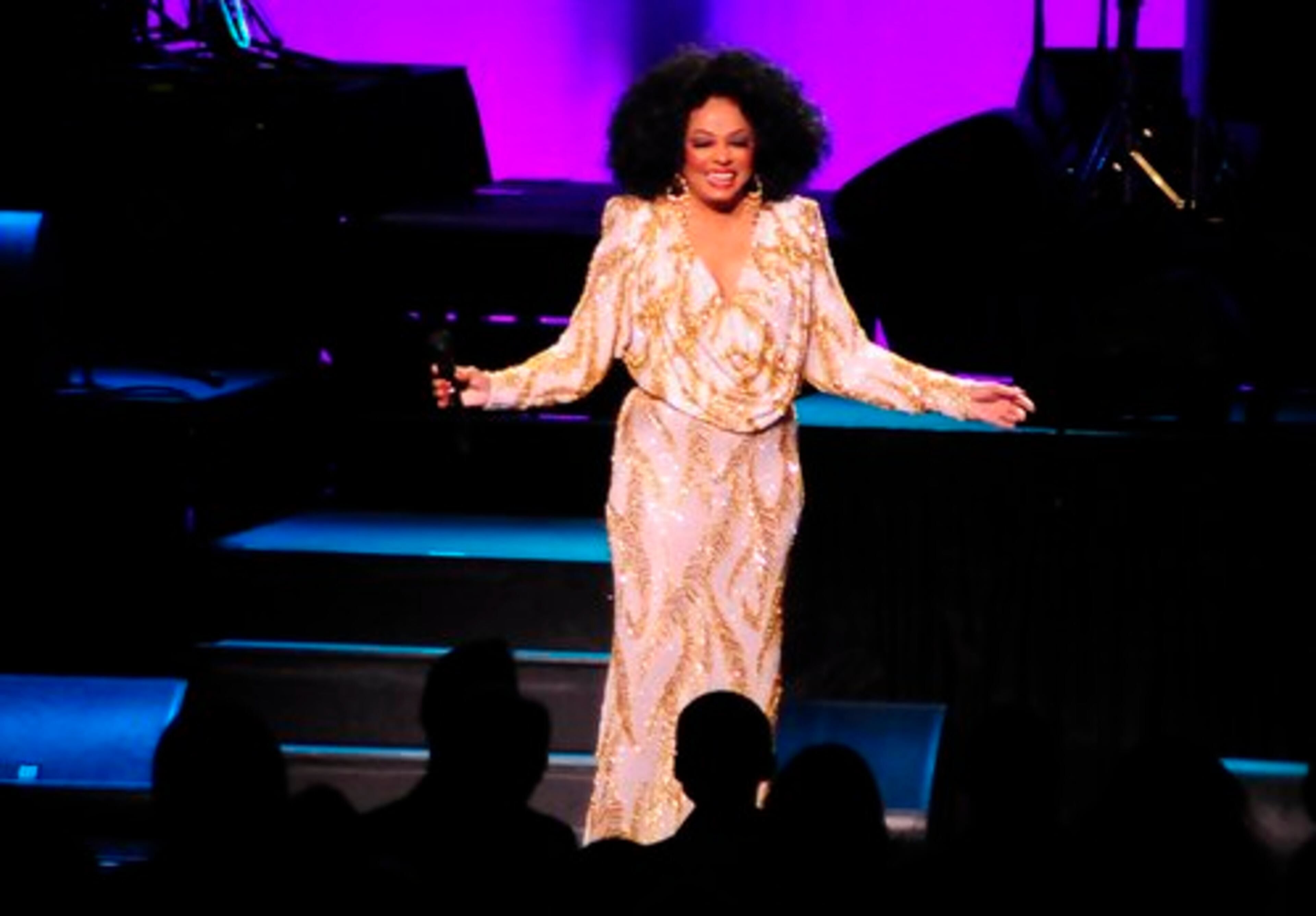 Diana Ross' trademark mound of ebony waves was in full effect, too, as she frequently dabbed at it .
