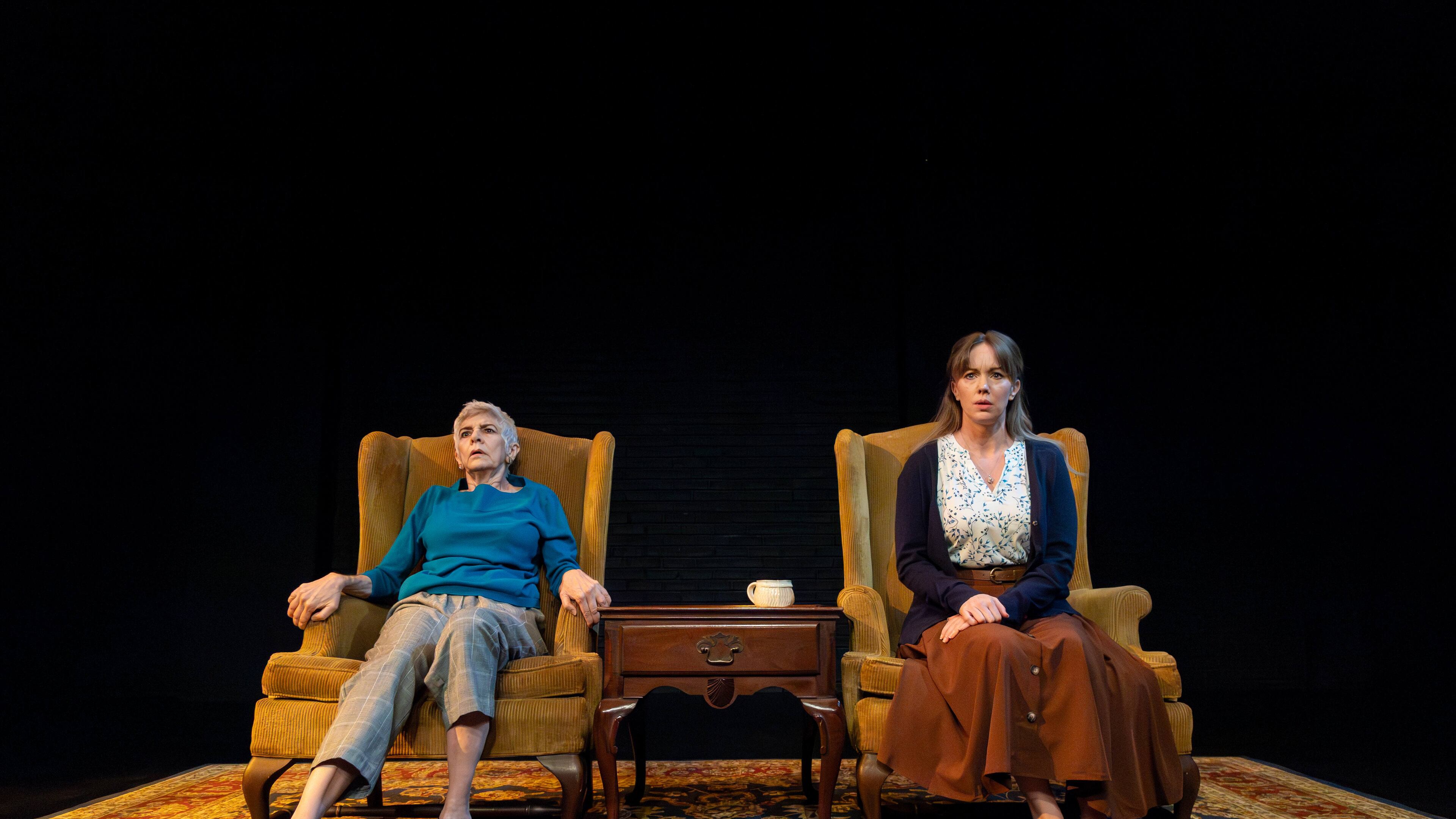 Mary Lynn Owen (left) as the mentalist Linda appears ready to bolt while keeping company with traumatized Hilda (Bethany Anne Lind) in "The Thin Place" at Actor's Express. (Photo by Casey Gardner Ford)