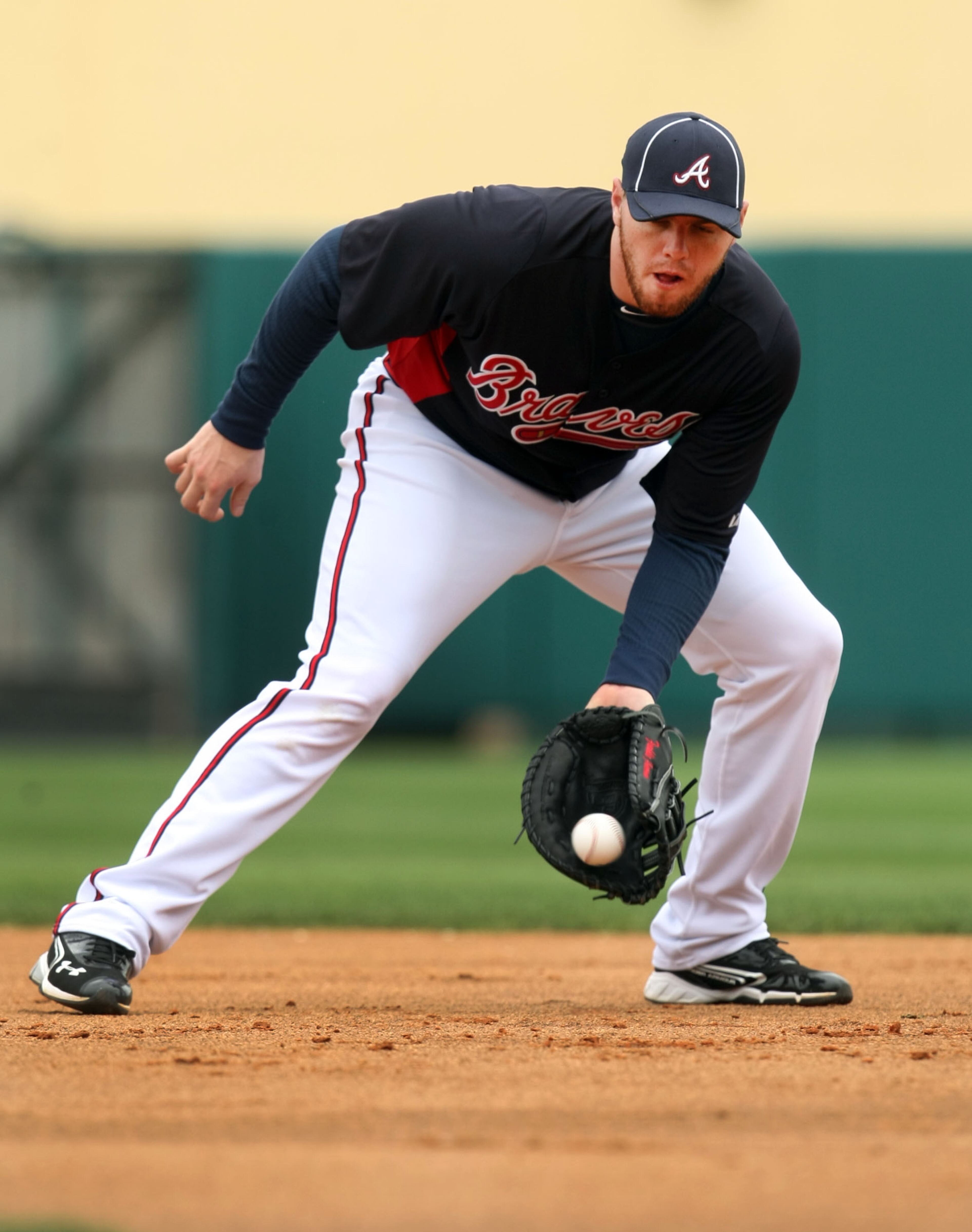 Feb. 26, 2012- LAKE BUENA VISTA, FL: Atlanta Braves first baseman Freddie Freeman fields a ground ball during the second full squad workout at Champion Stadium in the ESPN Wide World of Sports Complex Sunday afternoon in Lake Buena Vista, Fl., Feb. 26, 2012. Freeman is entering his second year after a solid rookie season. Jason Getz jgetz@ajc.com