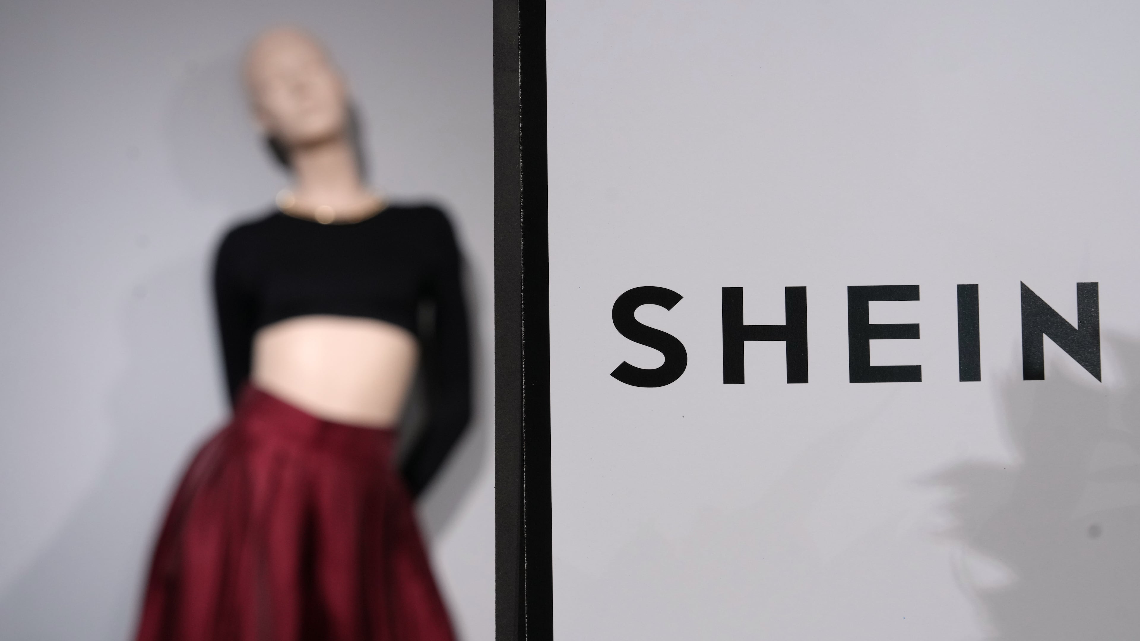 FILE - Clothes by Chinese company Shein are seen in the BHV (Bazar de l'Hotel de Ville) department store, Tuesday, Nov. 4, 2025 in Paris. (AP Photo/Aurelien Morissard, File)