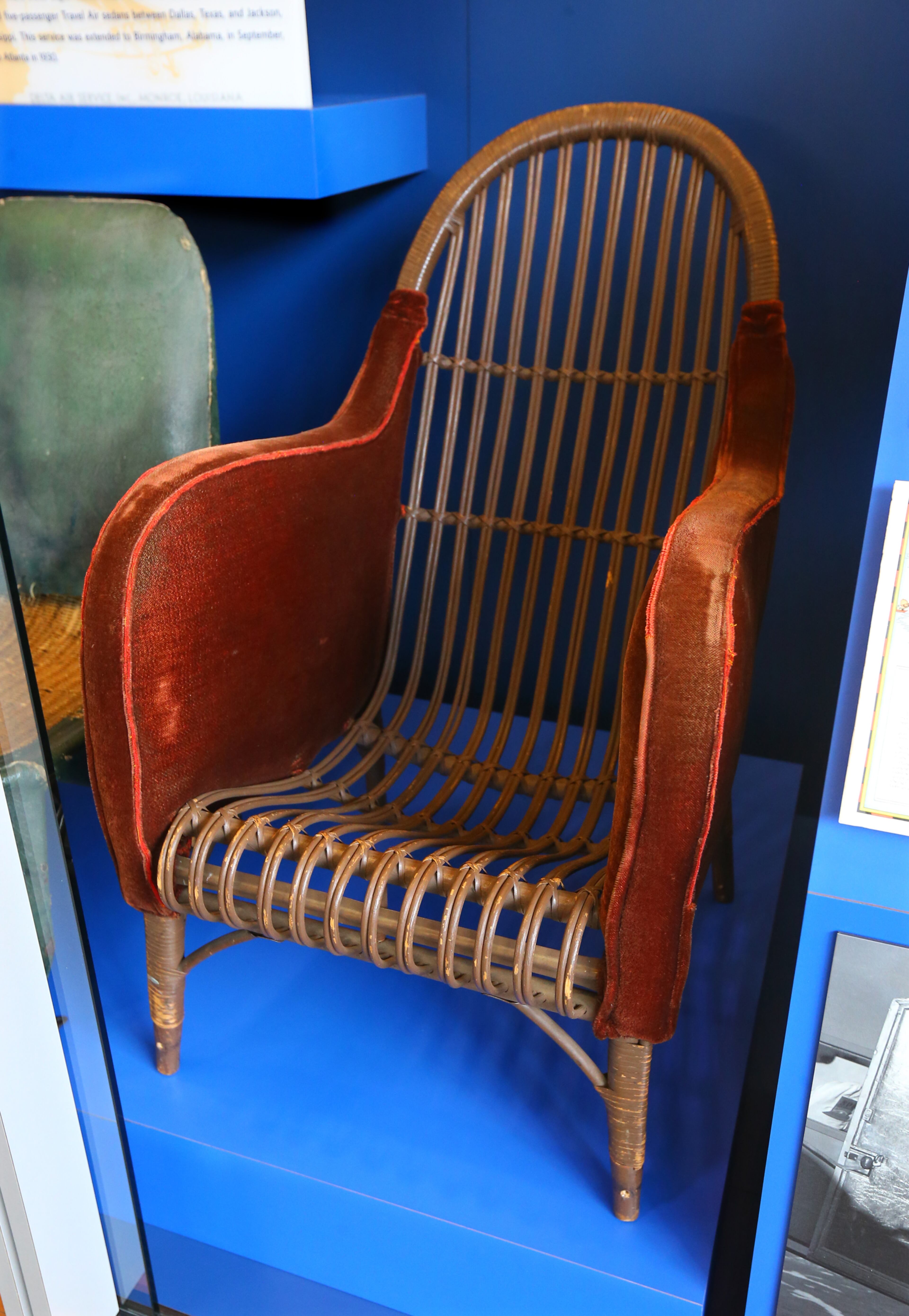 061214 ATLANTA: A wicker seat from a 1928 Western 12-passenter Fokker F-10 is part of a display at the Delta Flight Museum on Thursday, June 12, 2014, in Atlanta.The use of light-weight flexible wicker helped reduce the plane's weight and fuel useage. CURTIS COMPTON / CCOMPTON@AJC.COM