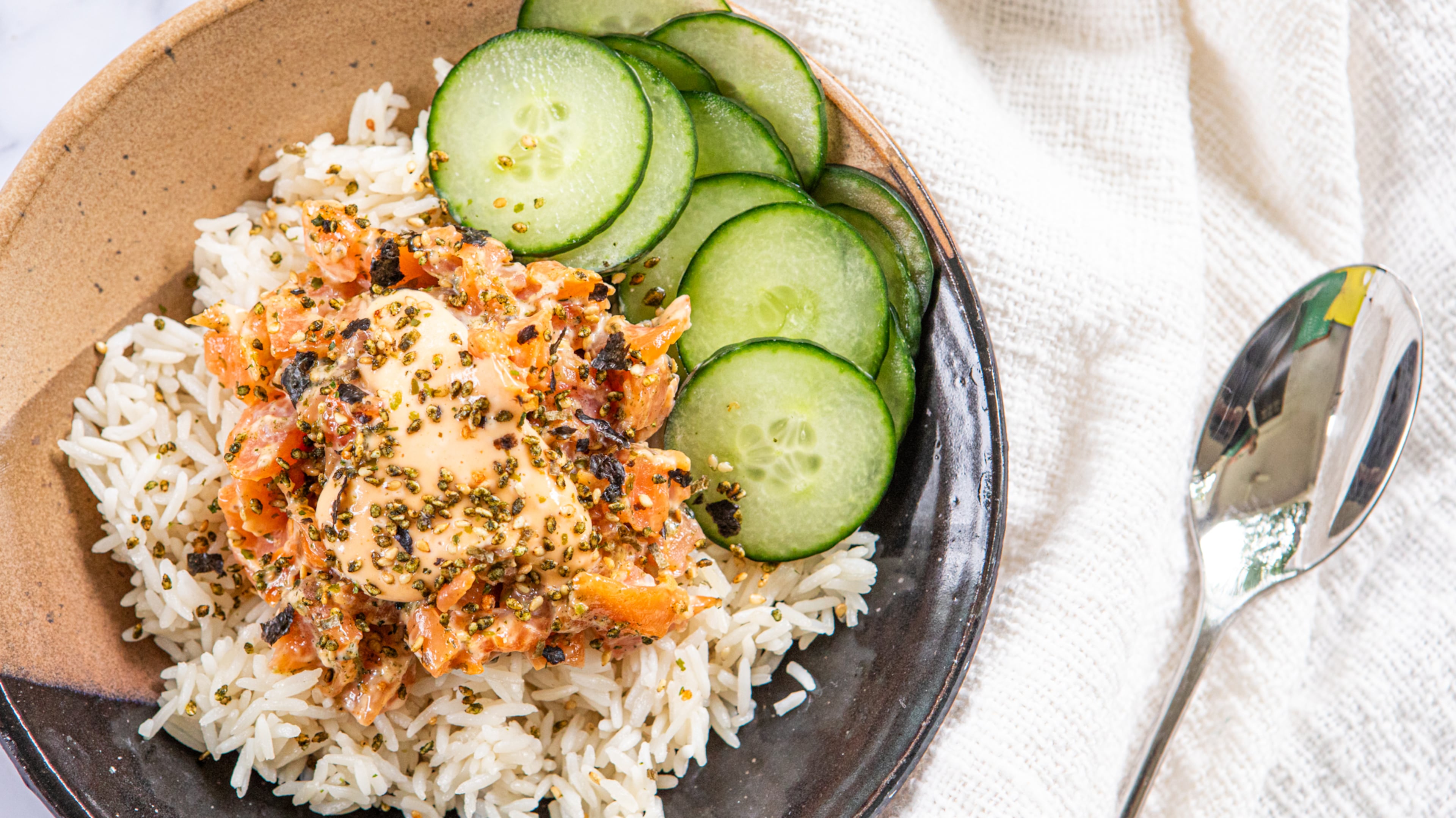 The subtle smokiness of cold-smoked salmon adds depth of flavor to Easy Salmon Poke Bowls. (Aaliyah Man for the AJC/food styling by Kate Williams)