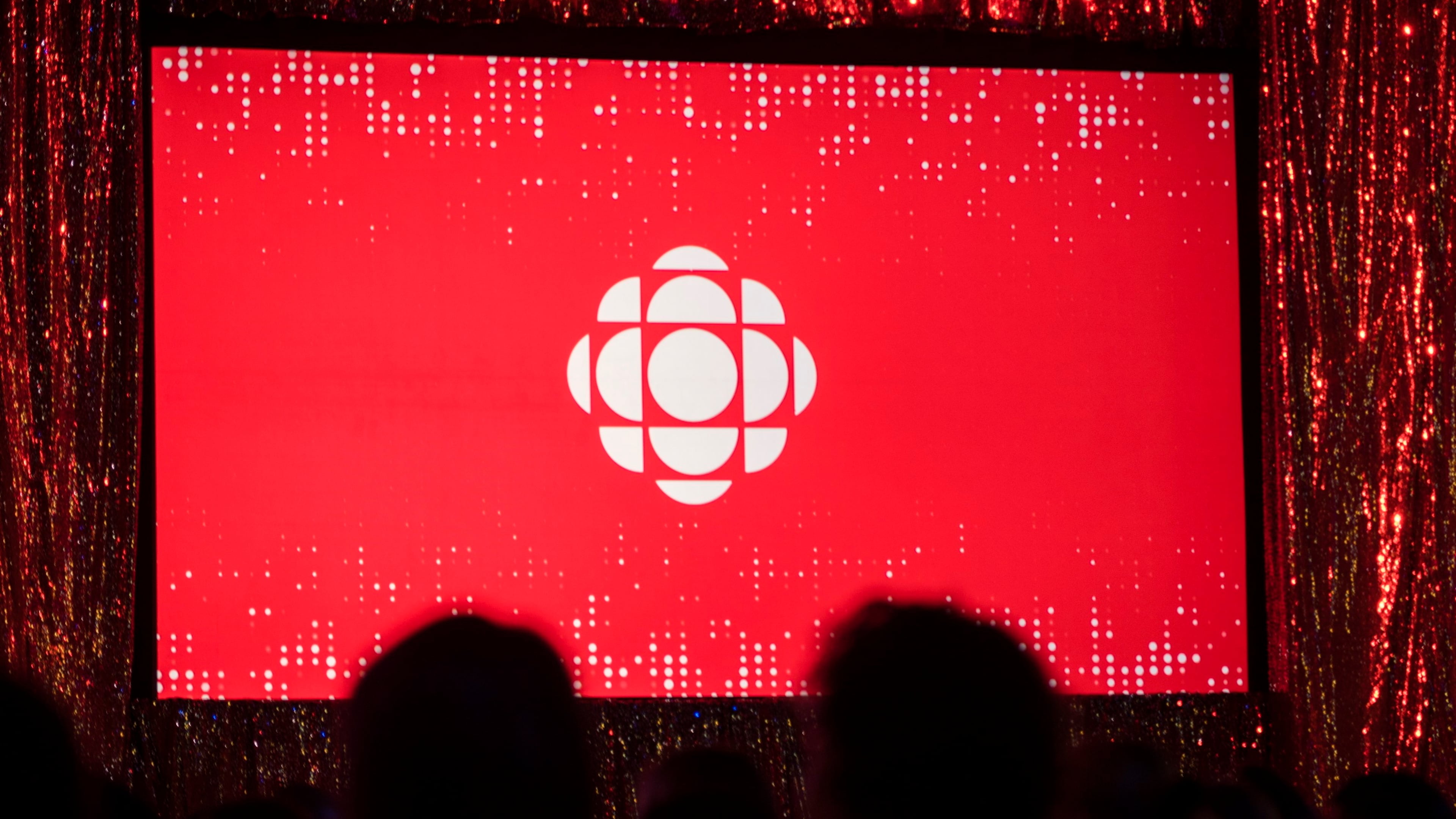 FILE - The Canadian Broadcasting Corporation logo is projected onto a screen on May 29, 2019, in Toronto. (Tijana Martin/The Canadian Press via AP,File)