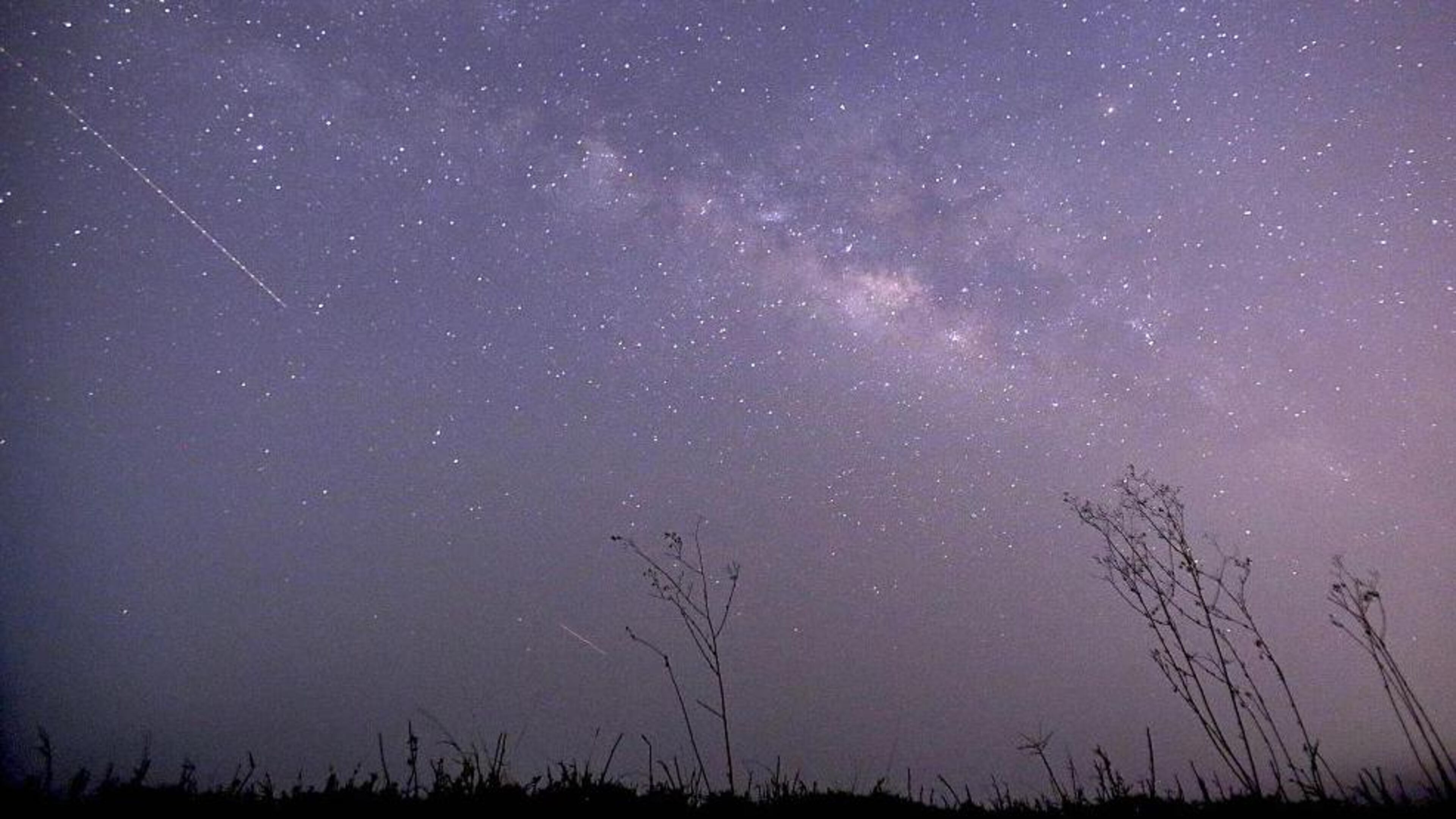 This long-exposure photograph shows the Lyrids meteors shower passing near the Milky Way in the clear night sky of Thanlyin, nearly 14miles away from Yangon in 2015.