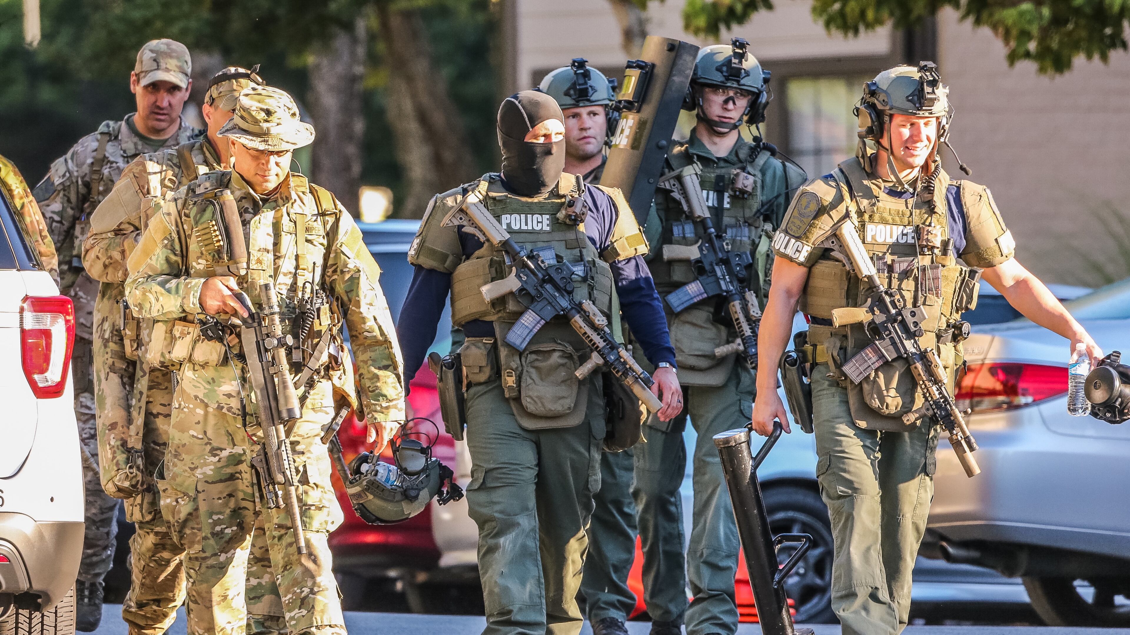 SWAT officers were deployed to a Gwinnett County apartment Thursday morning after a man barricaded himself inside one of the units. JOHN SPINK / JSPINK@AJC.COM