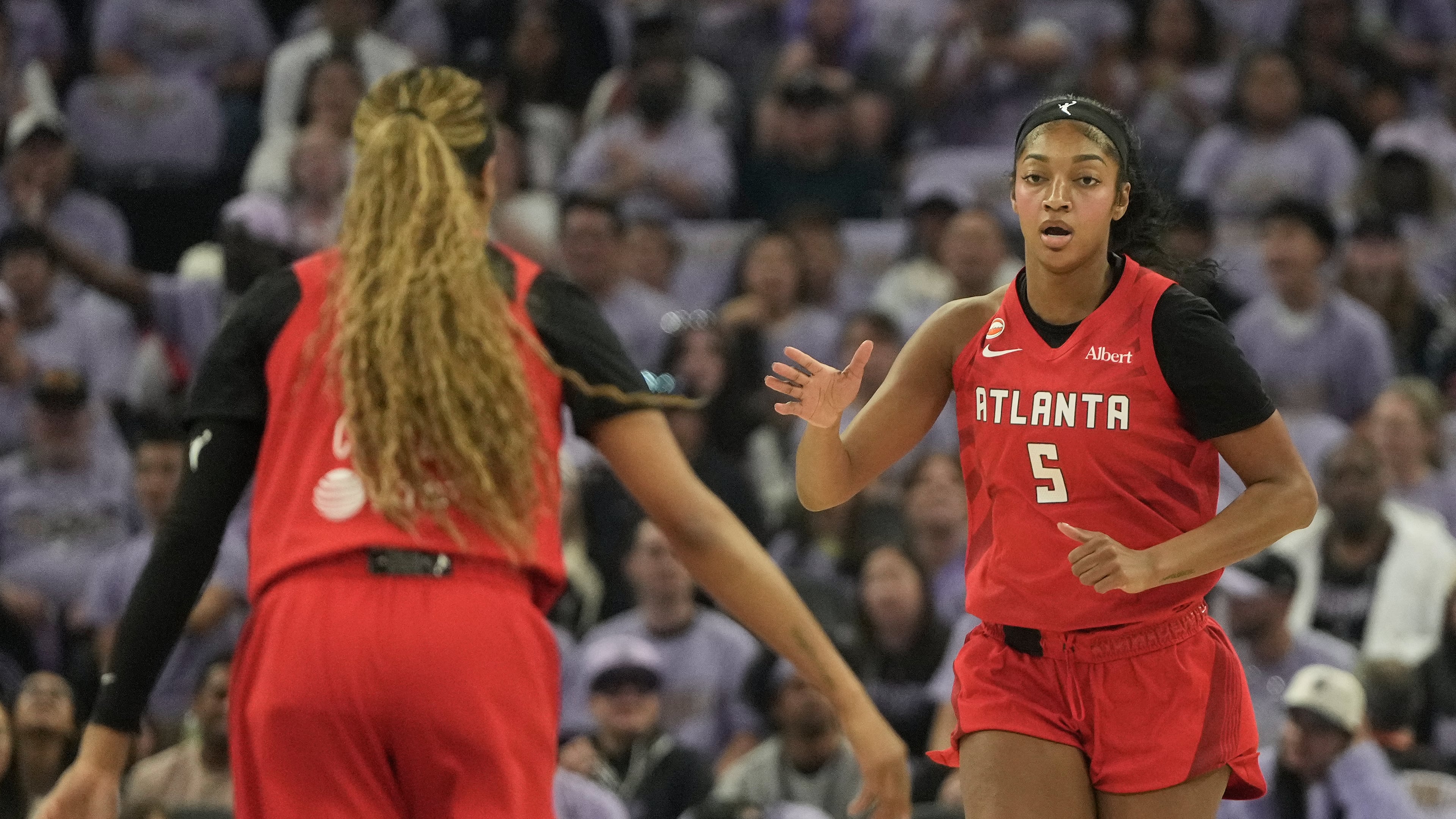 Atlanta Dream forward Angel Reese (right) is congratulated by guard Jordin Canada after scoring against the Golden State Valkyries during the first half of Game 1 of the WNBA finals, Saturday, Oct. 17, 2026, in San Francisco. (Jeff Chiu/AP)
