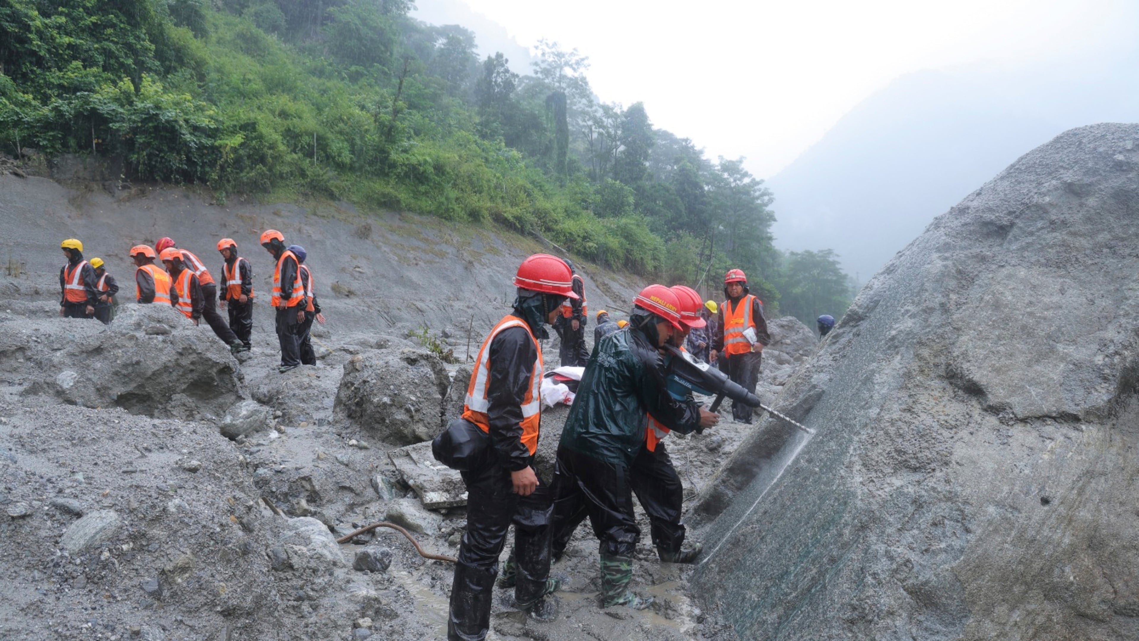 This photo provided by the Nepal Army, shows Nepal army soldiers using a drilling machine during a rescue operation at the site of a hydropower project in Upper Trishuli, Nepal, Sunday, Aug. 30, 2026. (Nepal Army via AP)