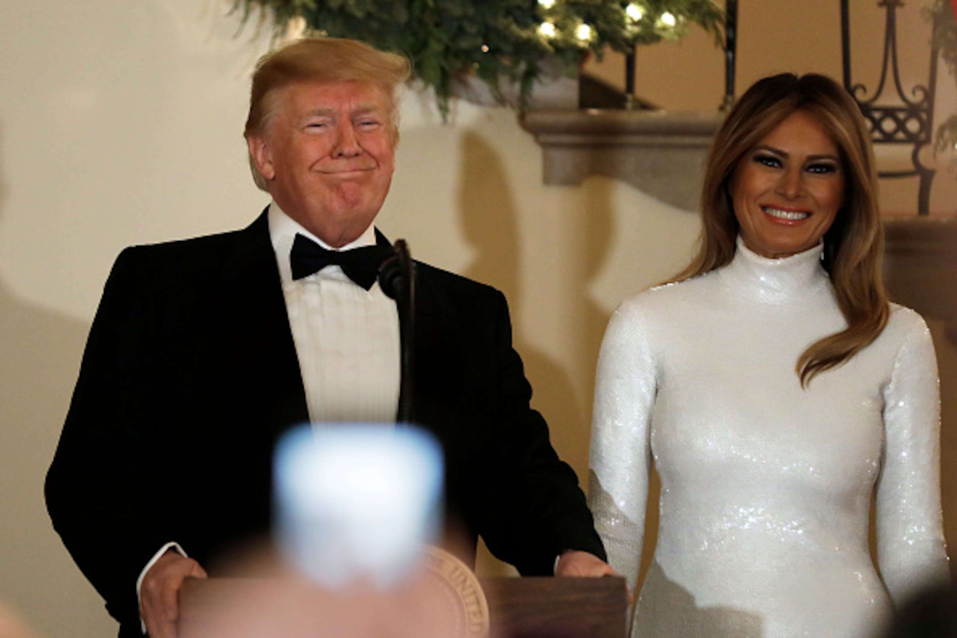 WASHINGTON, DC - DECEMBER 15: U.S. President Donald Trump speaks next to First Lady Melania Trump at the Congressional Ball at White House in Washington on December 15, 2018. (Photo by Yuri Gripas-Pool/Getty Images)