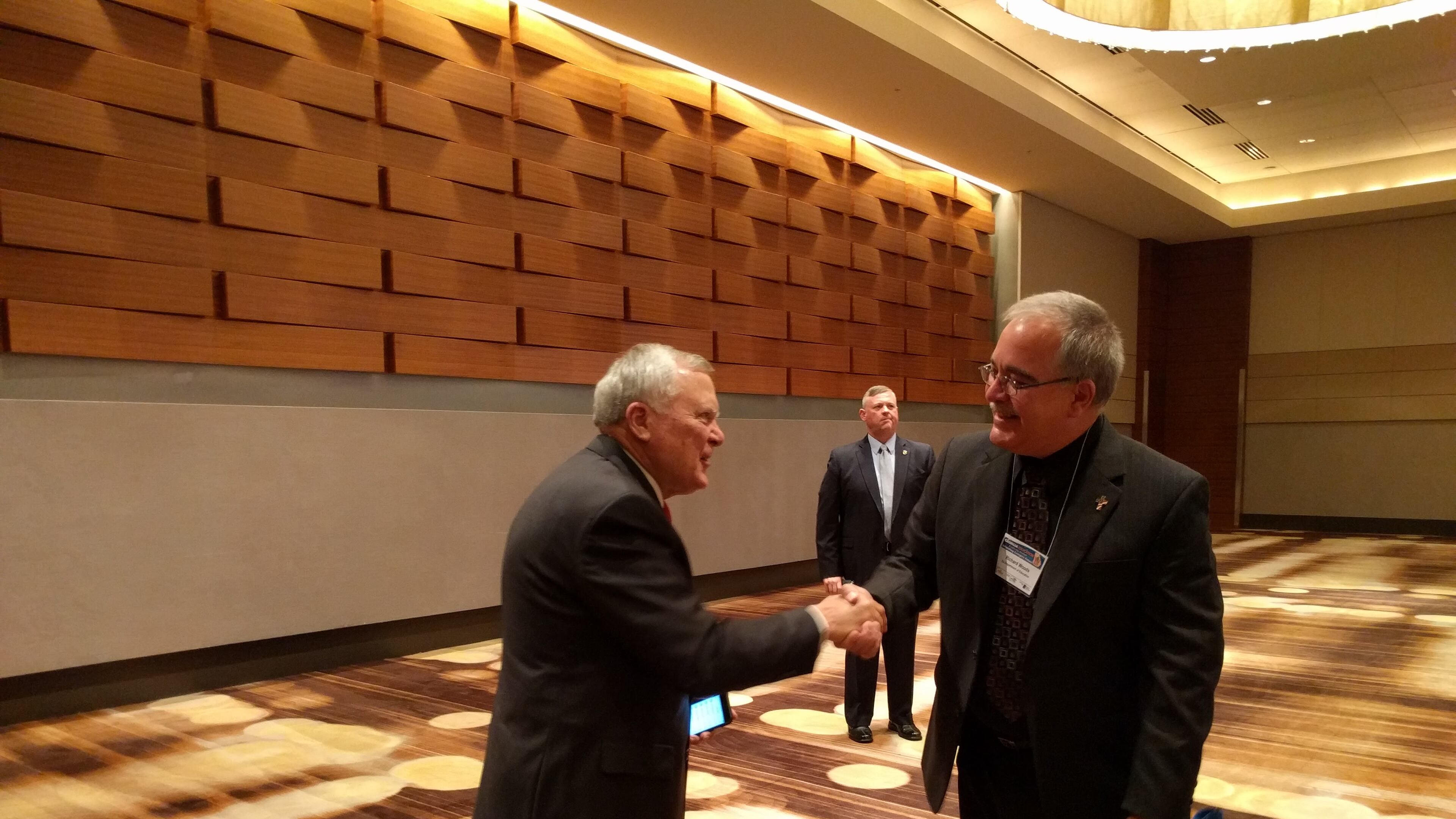 Gov. Nathan Deal, left, greets Georgia schools Superintendent Richard Woods before a meeting of education leaders where he criticized school boards for opposing his Opportunity School District and praised superintendents for mostly keeping silent about the issue. AJC/TY TAGAMI