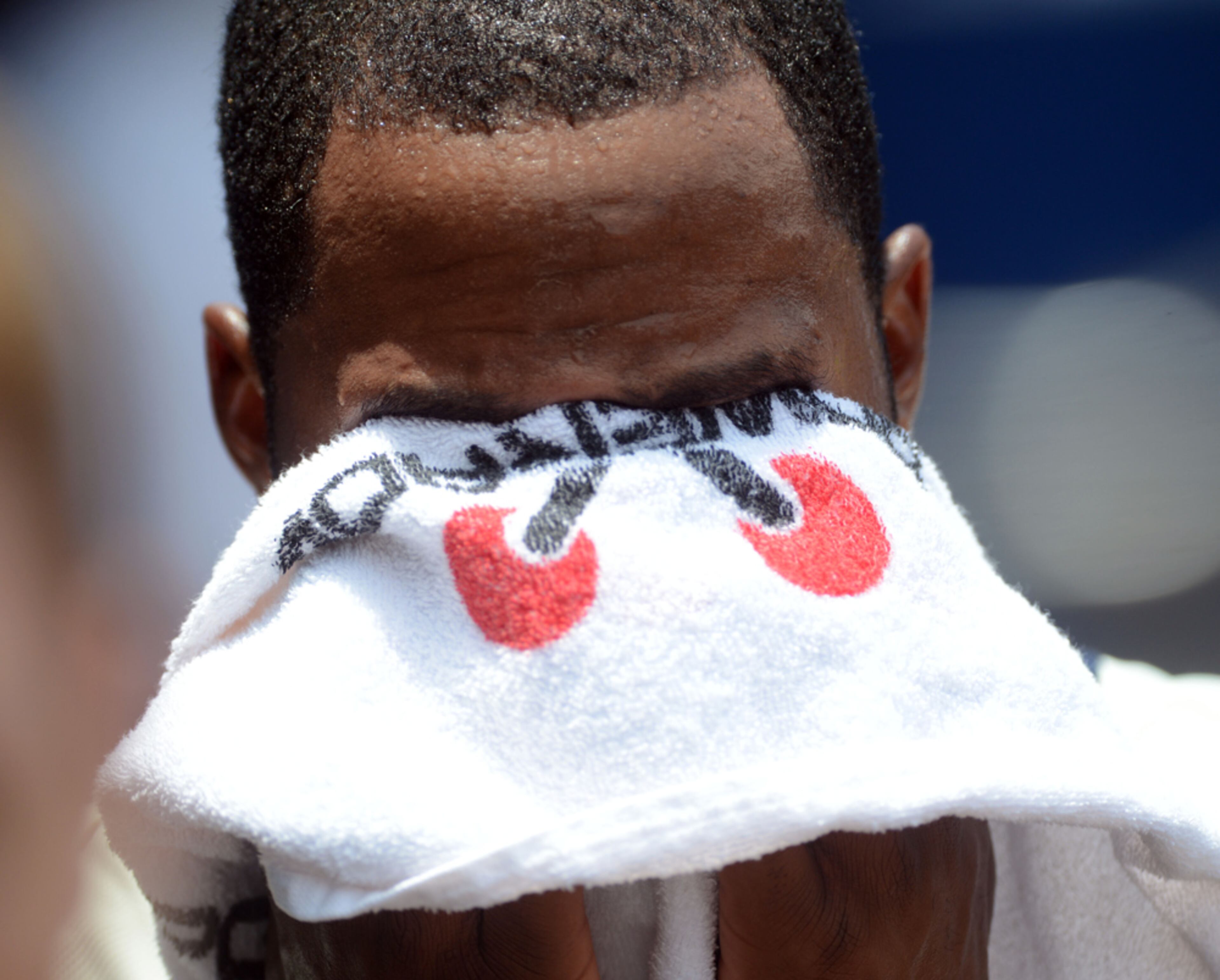 THE HEAT IS ON--JUNE 30, 2013 ATLANTA Braves outfielder Jason Heyward wipes his face during the game between the Braves and the Arizona Diamondbacks at Turner Field Sunday June 30, 2013. KENT D. JOHNSON/KDJOHNSON@AJC.COM