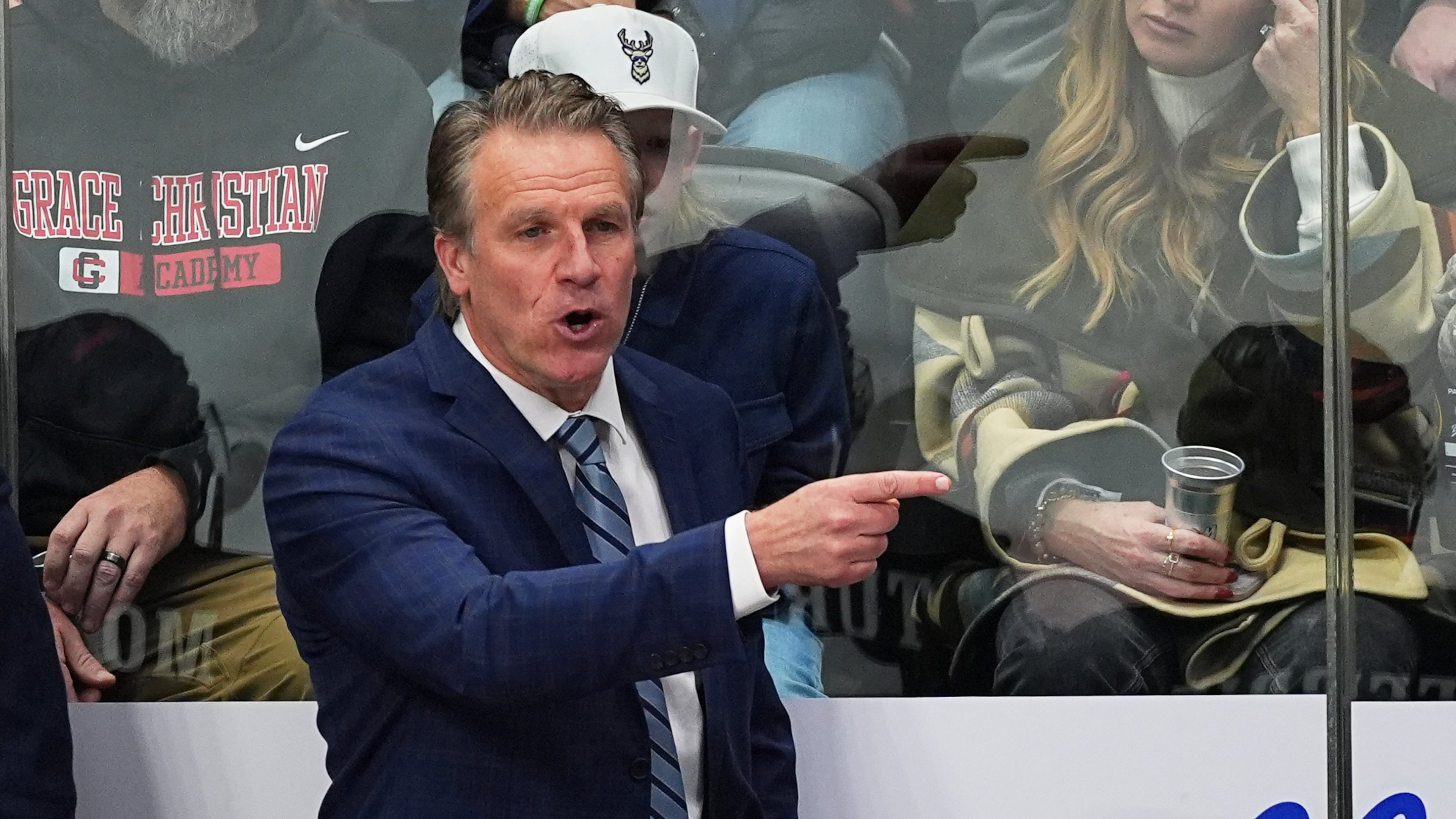 FILE - Los Angeles Kings head coach Jim Hiller directs his players from the team box in the third period of an NHL hockey game against the Colorado Avalanche Dec. 29, 2025, in Denver. (AP Photo/David Zalubowski, File)