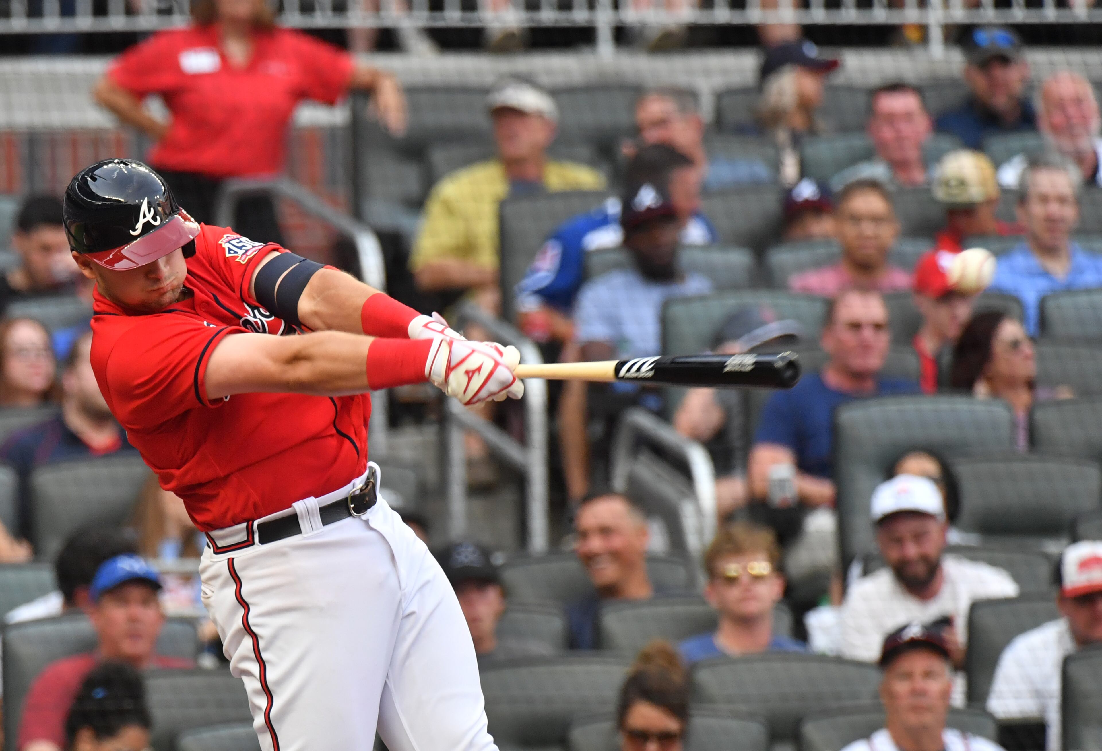 Braves third baseman Austin Riley (27) hits an RBI single to score Ozzie Albies in the first inning against St. Louis Cardinals at Truist Park on Friday, June 18, 2021. (Hyosub Shin / Hyosub.Shin@ajc.com)