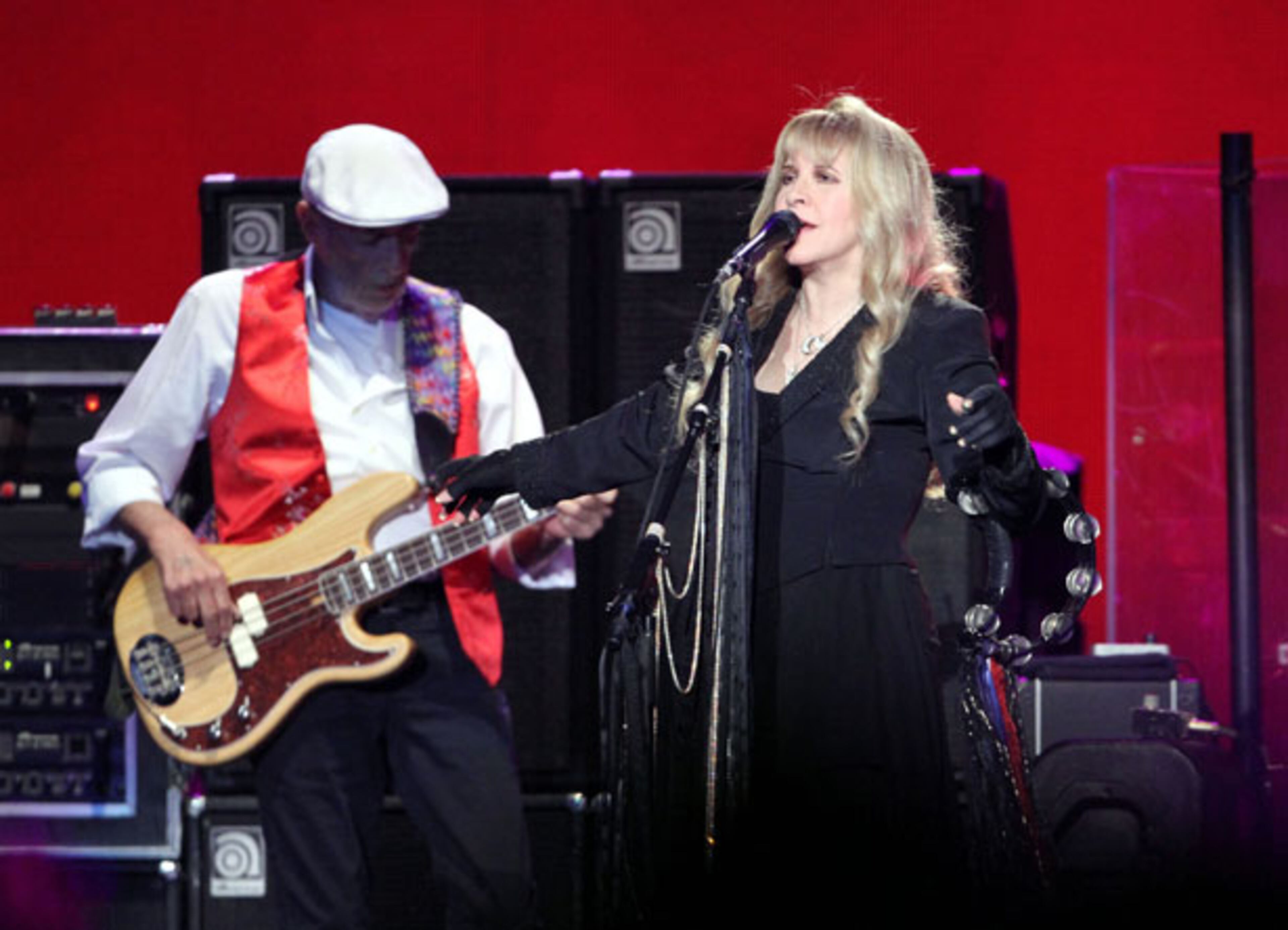John McVie and Stevie Nicks perform during Fleetwood Mac's On With the Show tour stop at a sold-out Philips Arena in Atlanta Wednesday, Dec. 17, 2014. The tour marks the first time in 16 years that Stevie Nicks, Mick Fleetwood, Lindsey Buckingham and John McVie have toured with Christine McVie. Robb D. Cohen/RobbsPhotos.com