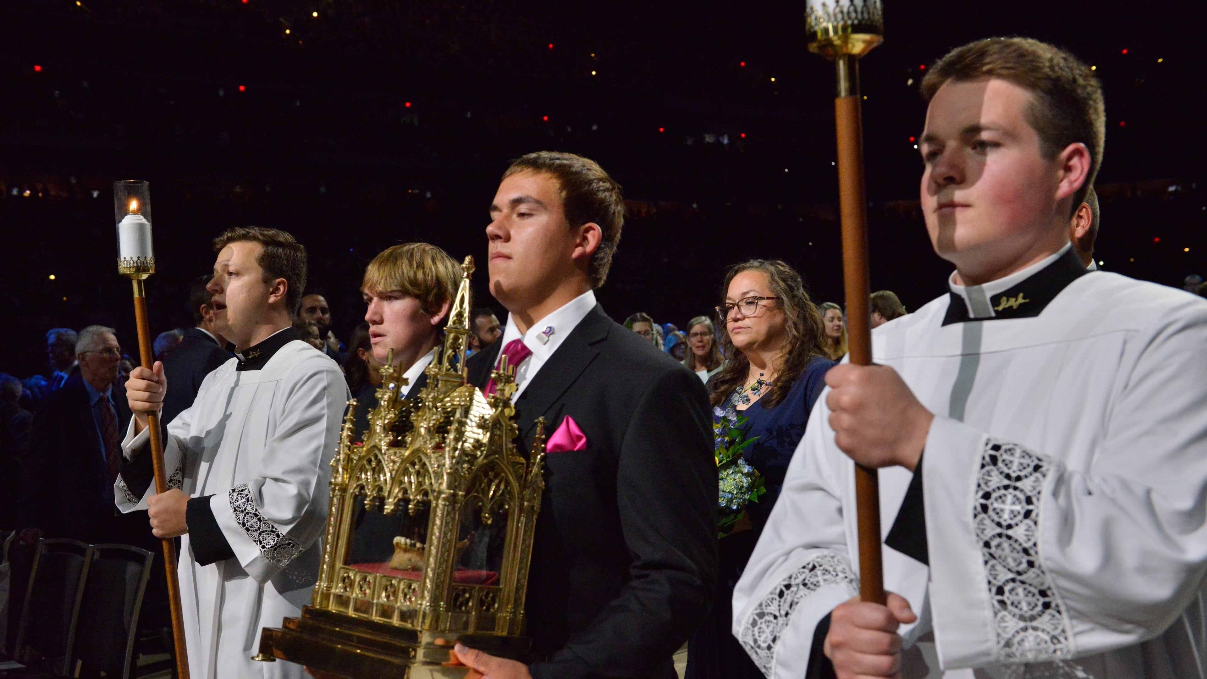 James Fulton Engstrom, center, his mother, Bonnie Engstrom, background center, and other family members present a relic of Archbishop Fulton Sheen during Sheen's beatification at the Dome at America's Center in St. Louis, on Thursday, Sept. 24, 2026. (AP Photo/Kate Munsch)