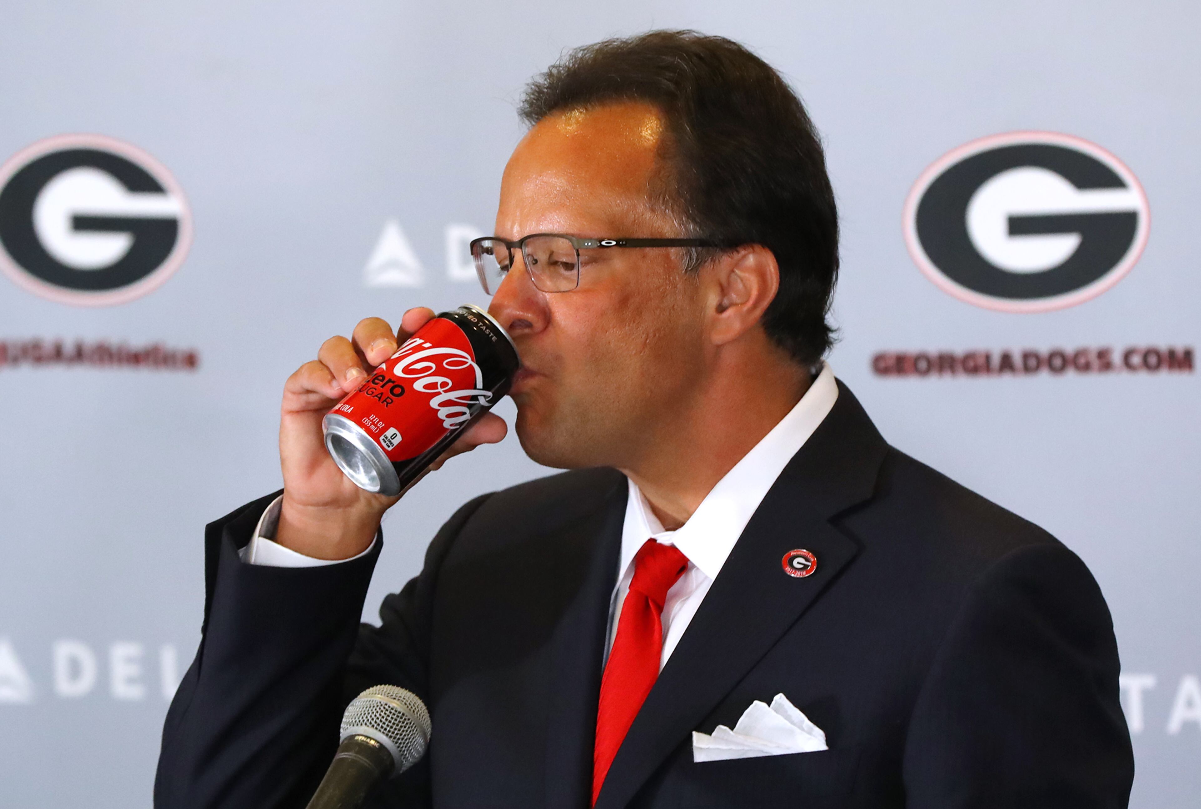March 16, 2018 Athens: Tom Crean drinks Coca-Cola Zero during his press conference while he is introduced as the new men's basketball head coach at the University of Georgia on Friday, March 16, 2018, at Stegeman Coliseum in Athens. Curtis Compton/ccompton@ajc.com