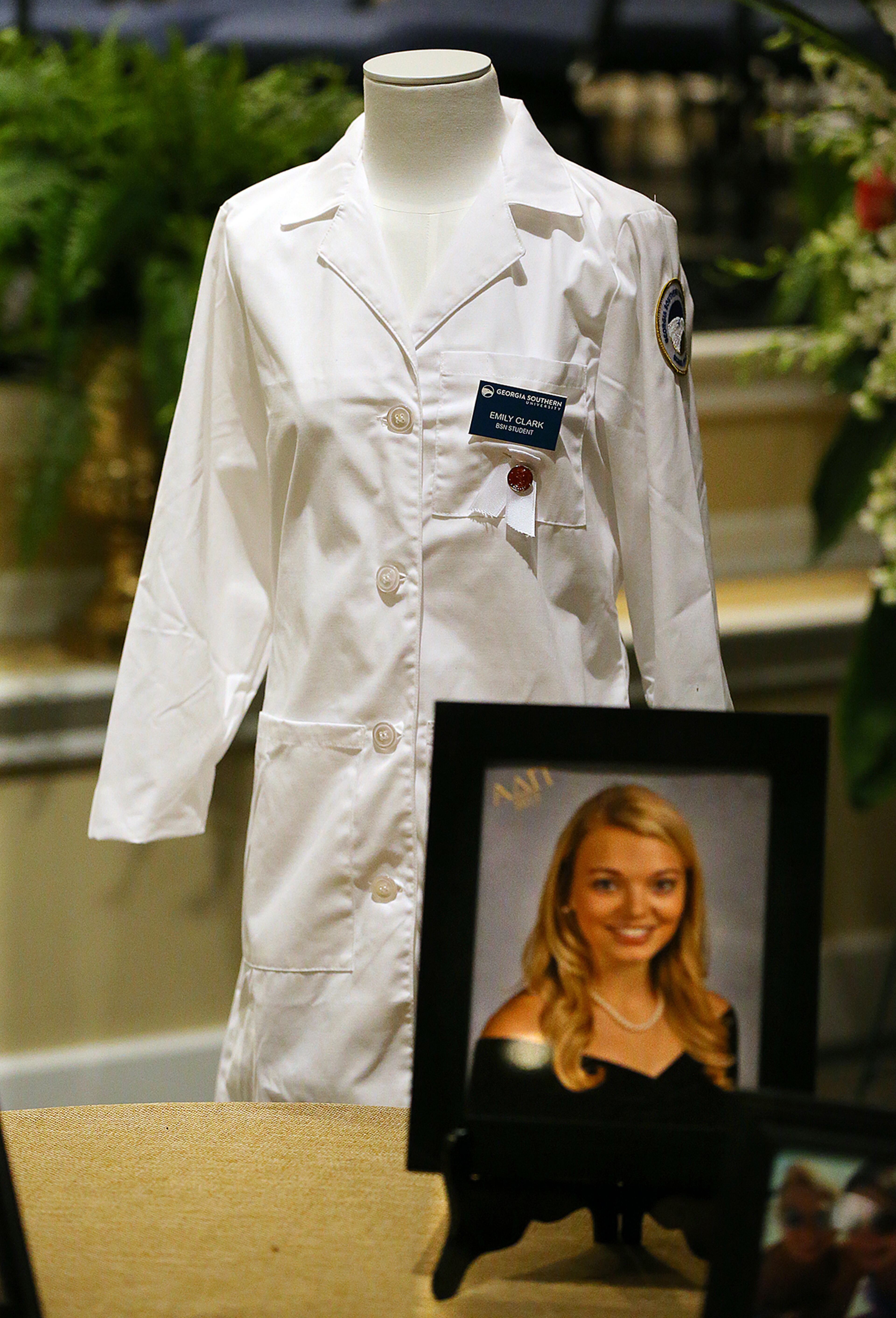 A nursing uniform is on display for the service of praise and celebration for the life of Emily Elizabeth Clark at Burnt Hickory Baptist Church on Sunday, April 26, 2015, in Powder Springs. Clark and four other nursing students from Georgia Southern University were killed in a multi-vehicle accident while fulfilling course work in their nursing program last week. Curtis Compton / ccompton@ajc.com