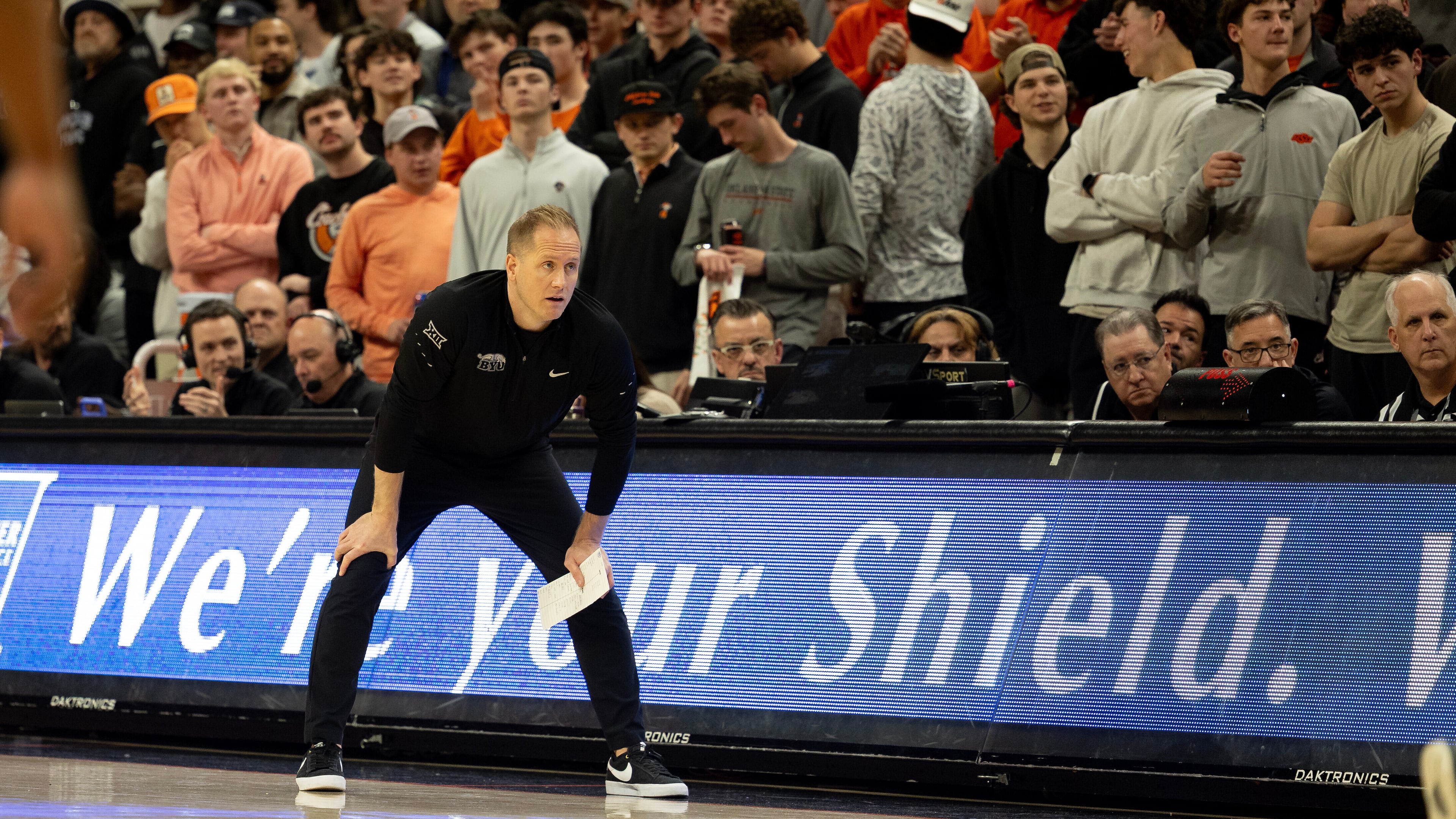BYU head coach Kevin Young stands on the baseline in the first half of an NCAA college basketball game against Oklahoma State, Wednesday, Feb. 4, 2026 in Stillwater, Okla. (AP Photo/Mitch Alcala)