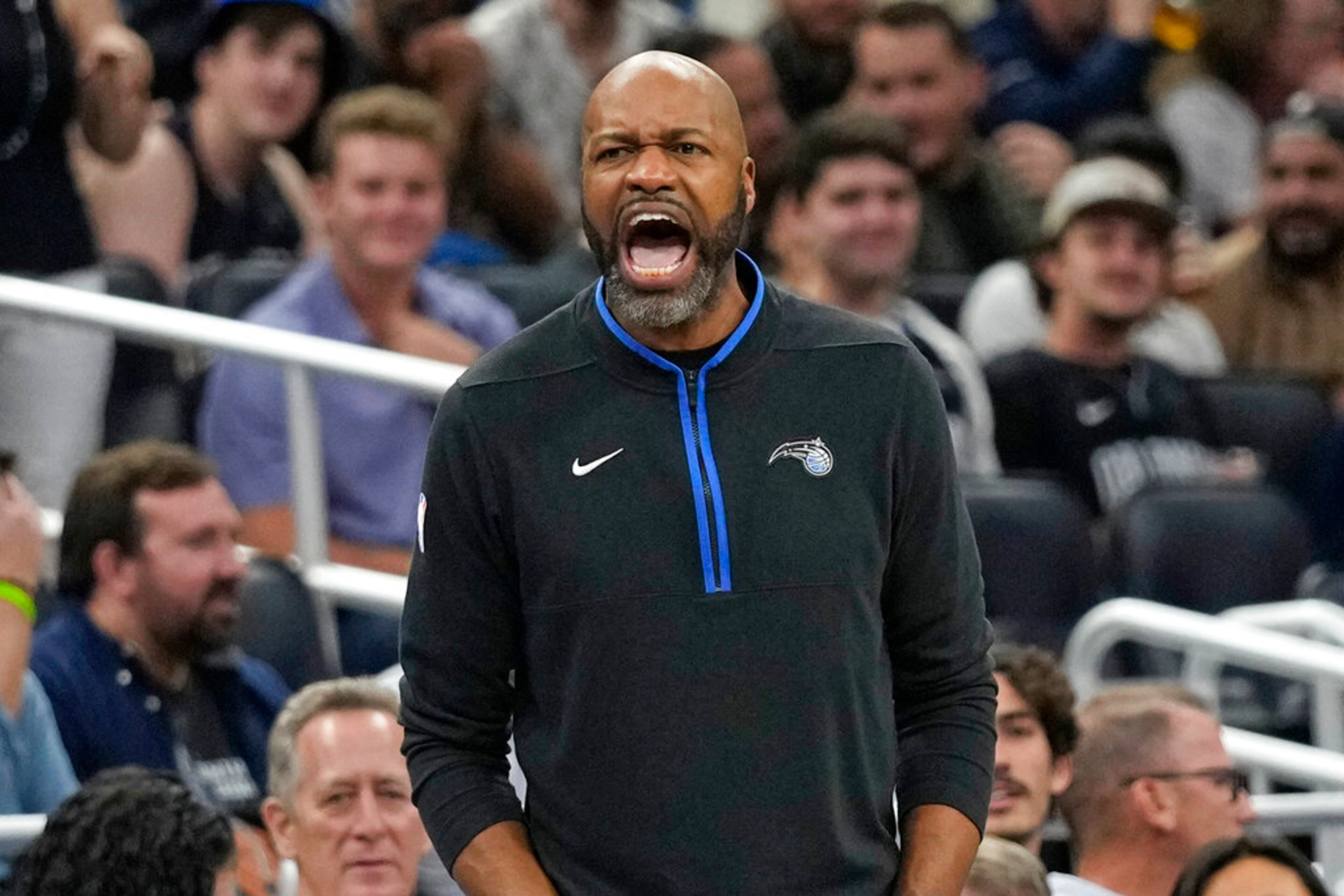 Orlando Magic head coach Jamahl Mosley shouts to players during the first half of an NBA basketball game against the Atlanta Hawks, Wednesday, Dec. 14, 2022, in Orlando, Fla. (AP Photo/John Raoux)