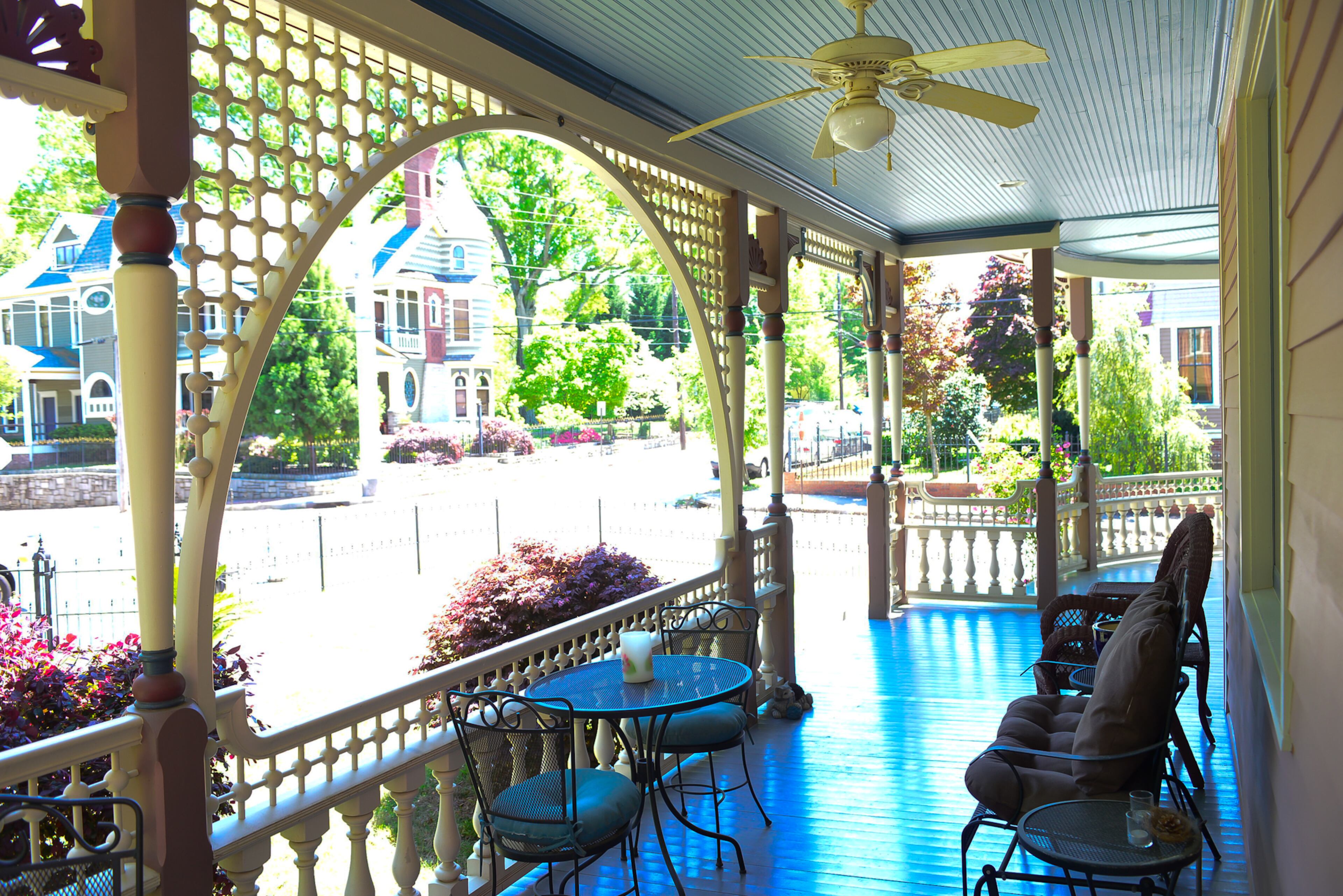 Gingerbread trim details run the length of Mike and Carolyn Dufano's front porch, and the Grant Park couple often eats dinner there while enjoying the views in their historic Atlanta neighborhood.