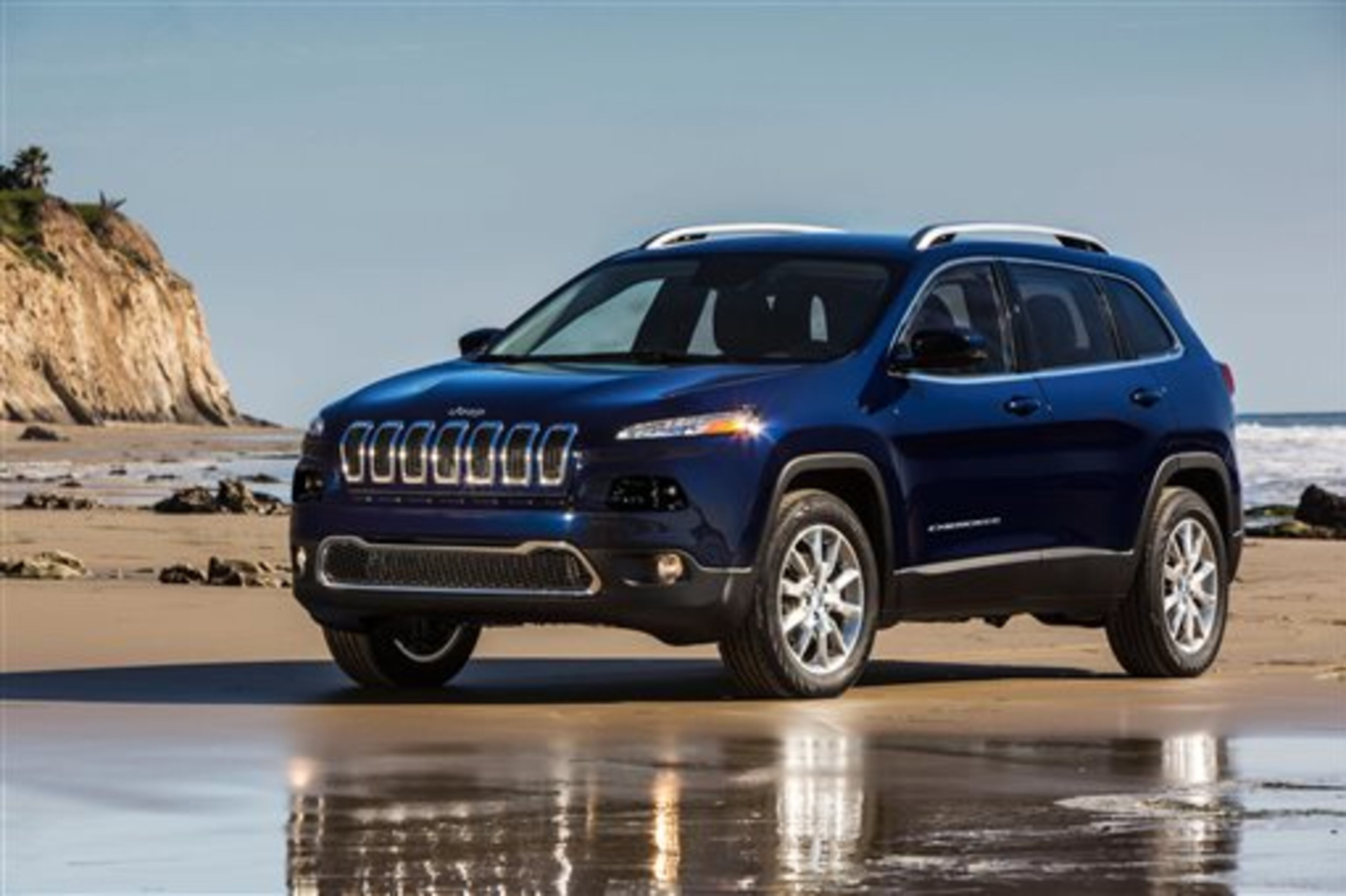 This undated publicity photo provided by the Chrysler Group LLC shows the all-new 2014 Jeep Cherokee Limited. The new Cherokee has a dramatic look that makes one wonder if it's a Jeep. It ditches the traditional boxy look for a more aerodynamic style and replaces the brand's round headlights with sharply angled slits. It has a much smaller grille. (AP Photo/Chrysler Group LLC)