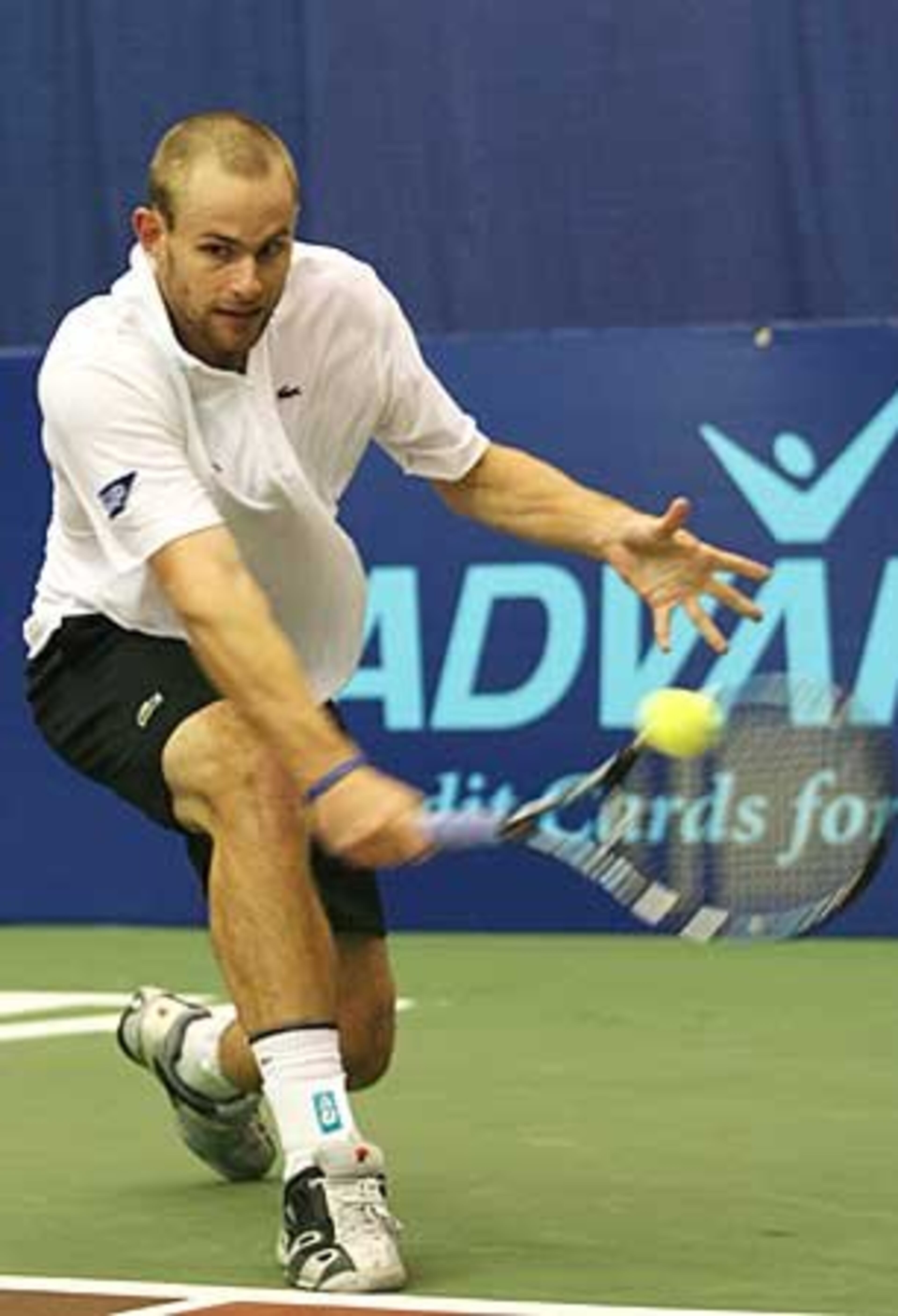 Andy Roddick hits a backhand during the Advanta WTT Smash Hits tennis event at Kennesaw State University.