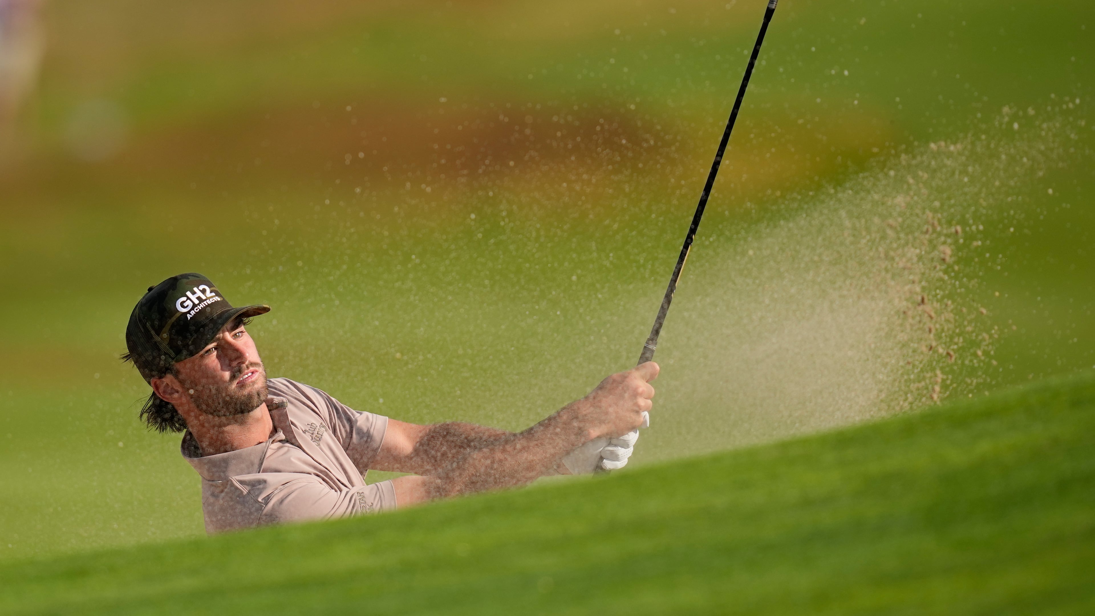 Ryder Cowan hits from the bunker on the second hole during the first round of the U.S. Open golf tournament at Shinnecock Hills Golf Club in Southampton, N.Y., Thursday, June 18, 2026.(AP Photo/David J. Phillip)