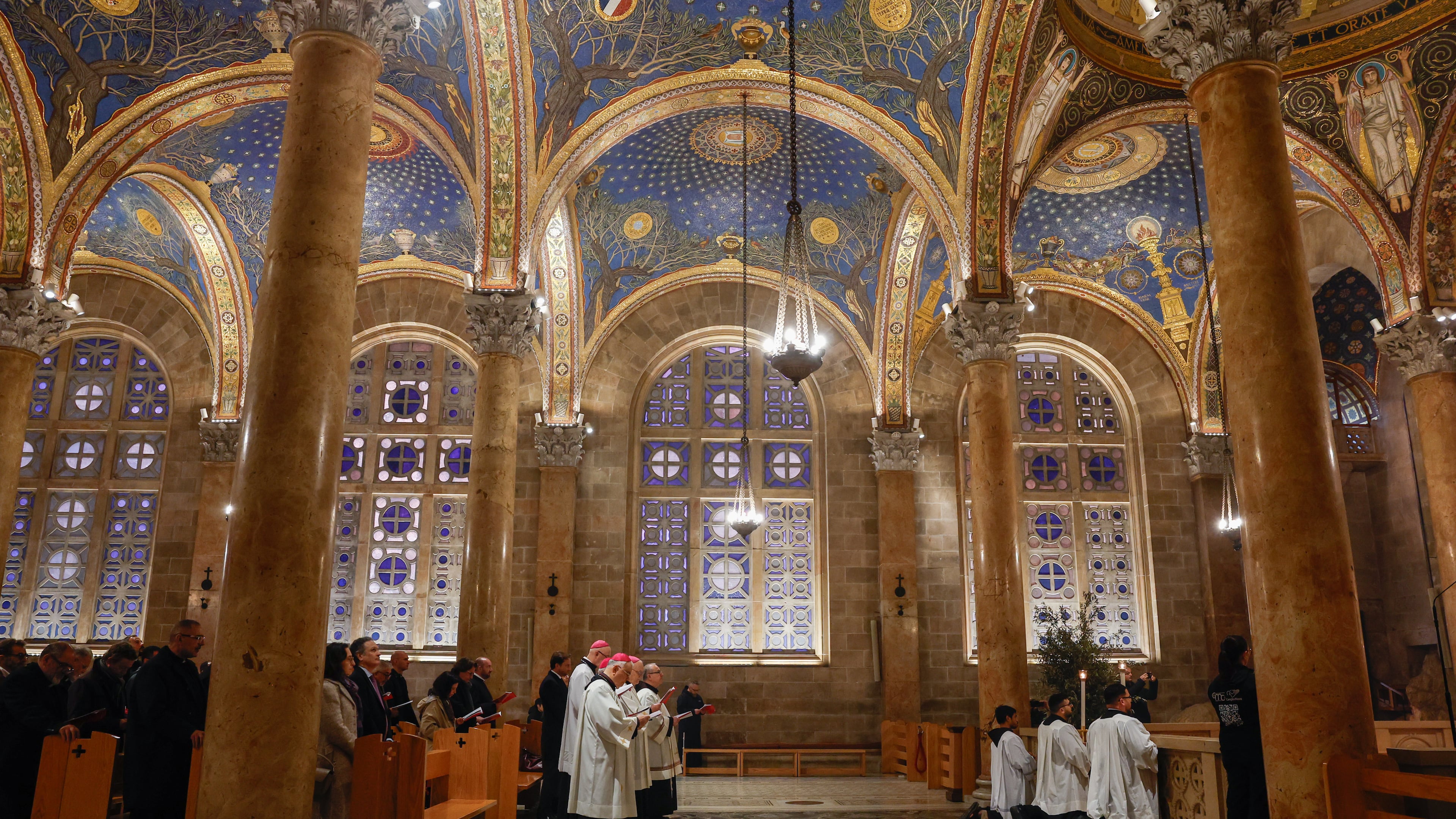 Faithful attend a prayer service in the Church of All Nations, held by Cardinal Pierbattista Pizzaballa, the Latin Patriarch of Jerusalem, to mark Palm Sunday in Jerusalem, Sunday, March 29, 2026. (Ammar Awad/Pool Photo via AP)