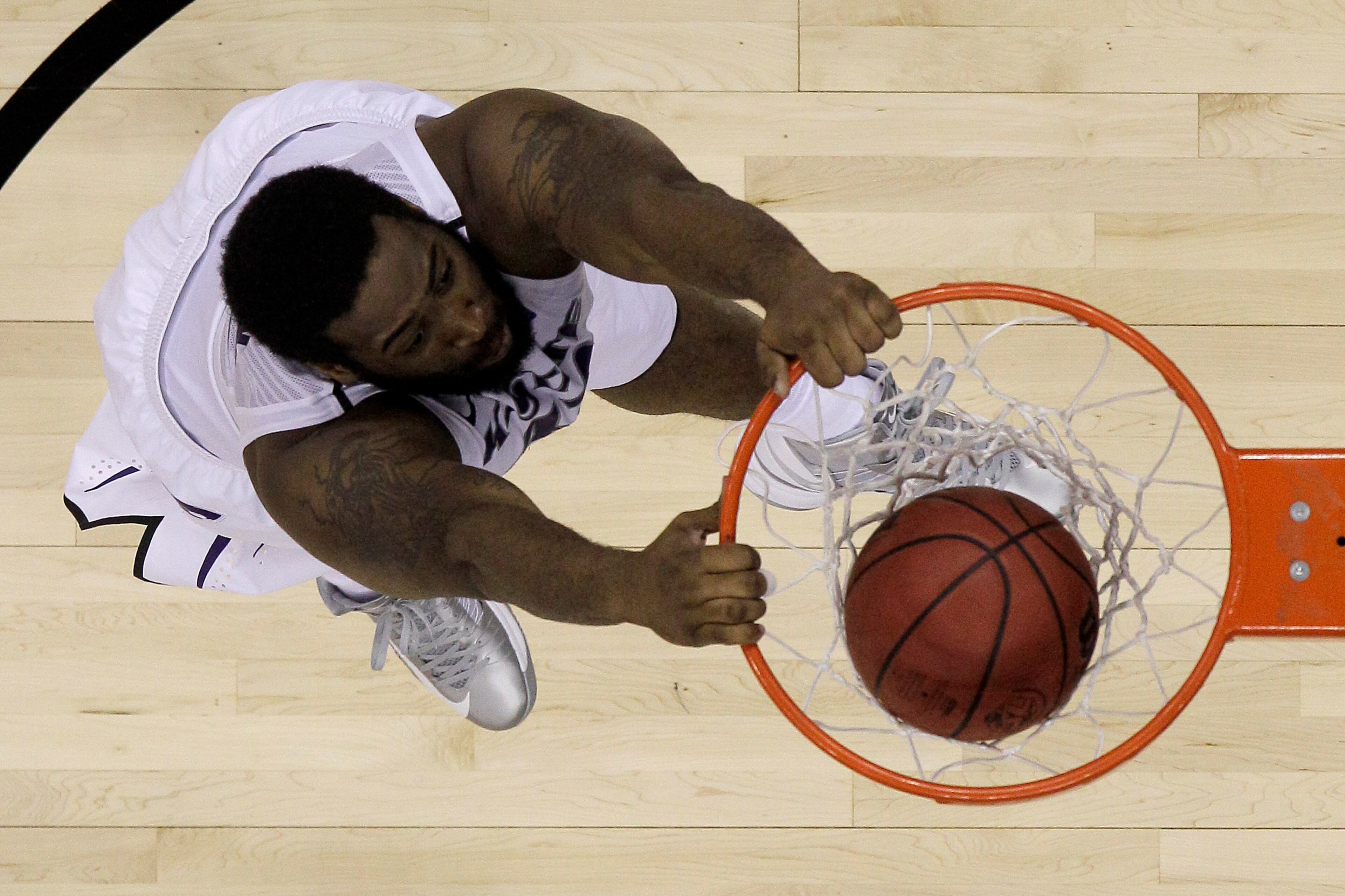 Kansas State forward Thomas Gipson (42) dunks the ball during the second half of a second-round game against La Salle in the NCAA college basketball tournament Friday, March 22, 2013, in Kansas City, Mo. La Salle won the game 63-61. (AP Photo/Charlie Riedel)