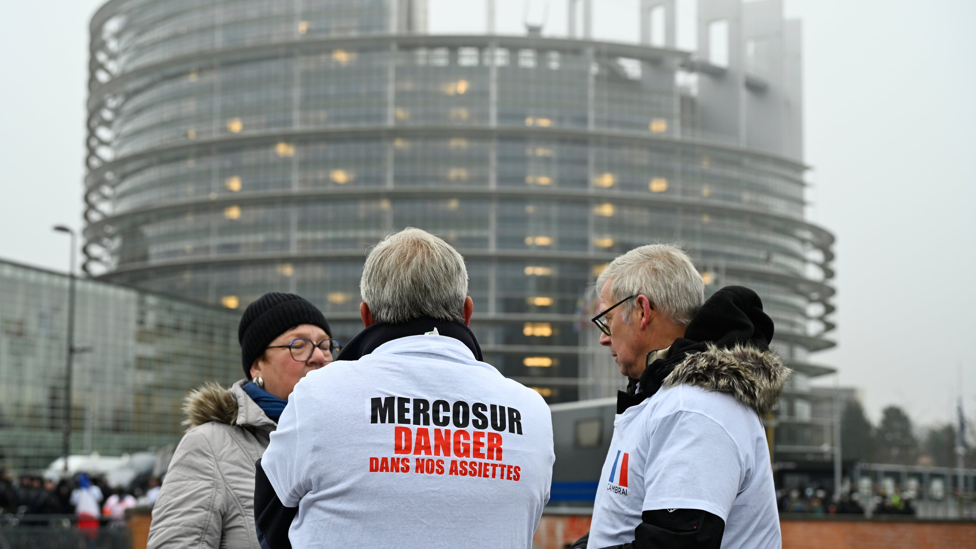A protestor wears a shirt which reads "Mercosur-danger on our dinner plate" as he participates in a demonstration against the EU-Mercusor trade agreement, outside the European Parliament in Strasbourg, eastern France, Tuesday, Jan. 20, 2026. (AP Photo/Pascal Bastien)