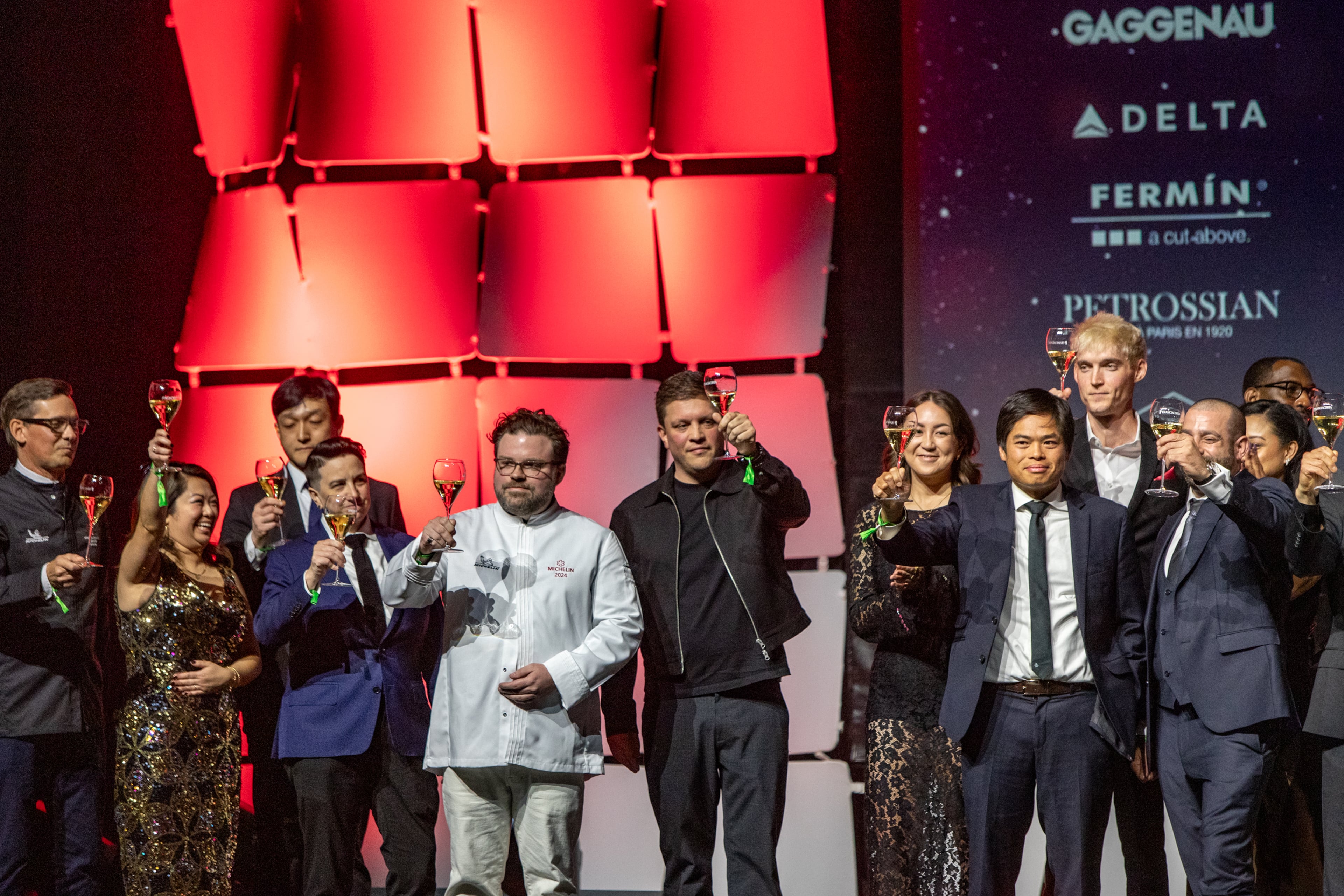 The Michelin Guide Awards take place at the Georgia World Congress Center on Monday, Oct 28, 2024. Michelin stars were awarded to Staplehouse's general manager David Chapman, center in white jacket, who celebrates with chefs who kept their stars this year and the other honorees, including O By Brush Executive Chef Jason Liang; Omakase Table Executive Chef Leonard Yu and Spring Executive Chef Brian So. (Jenni Girtman for The Atlanta Journal-Constitution)