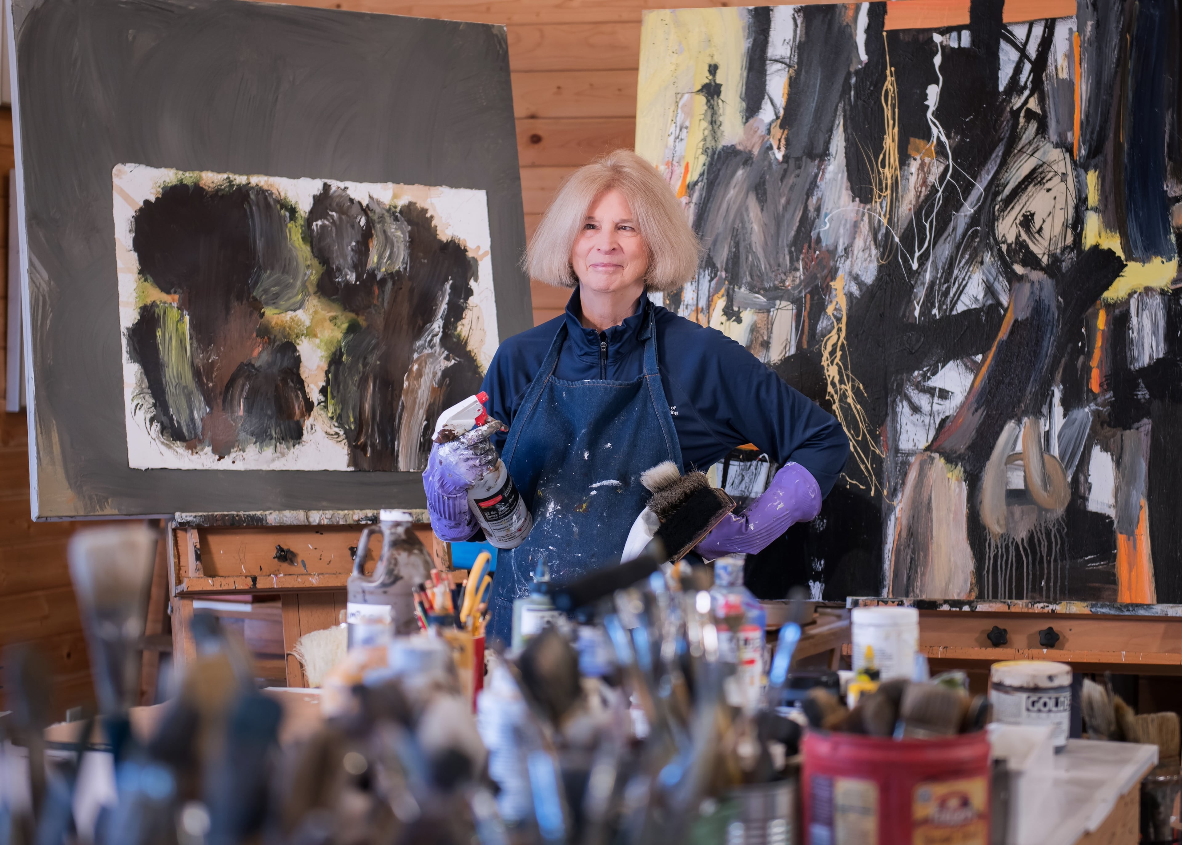 Susan Robert in her element, framed by the tools of her art trade, in her Highlands, North Carolina, studio. (Courtesy of Birney Robert)