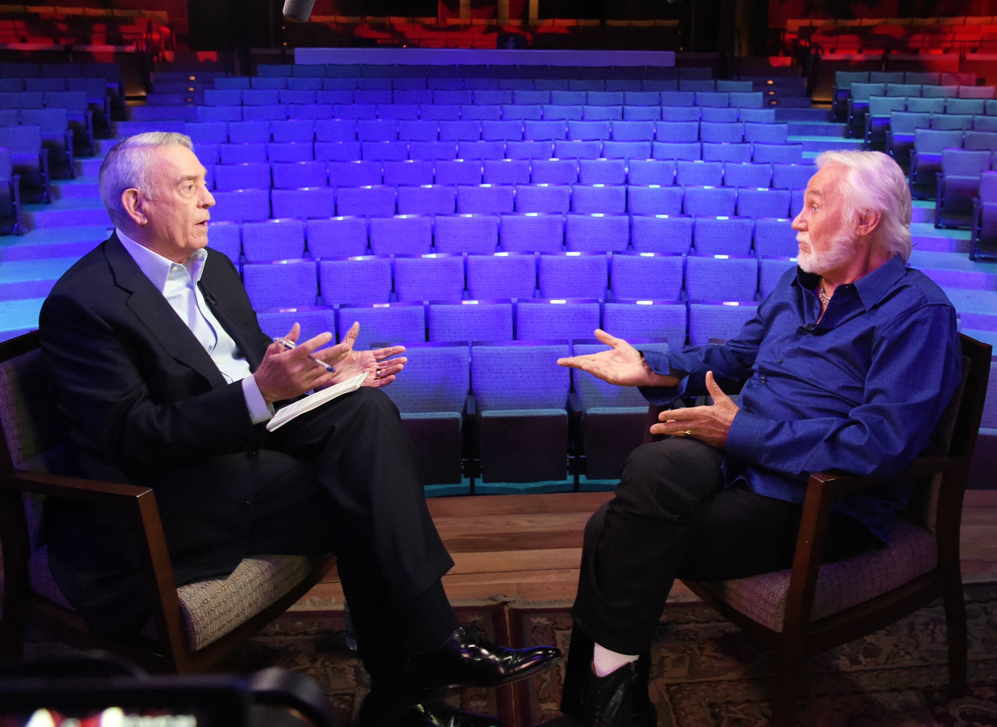 Dan Rather (right) interviews Kenny Rogers at The Country Music Hall of Fame and Museum on July 31, 2014 in Nashville. An exhibit highlighting Kenny Rogers' career will open at The Country Music Hall of Fame and Museum next month. "The Big Interview With Dan Rather" will air later this summer. (Photo by Rick Diamond/Getty Images for Dan Rather:The Big Interview)