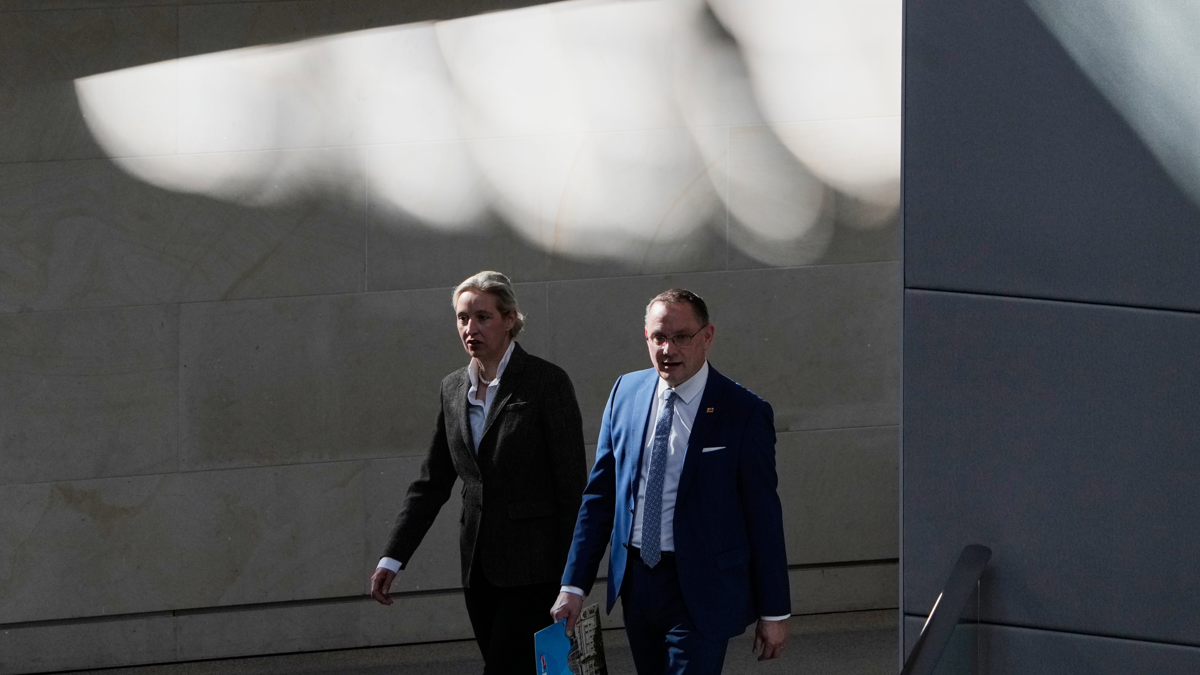 FILE - AfD Co-leaders Alice Weidel, left, and Tino Chrupalla attend a session of the German parliament in Berlin, Germany, March 18, 2026. (AP Photo/Markus Schreiber, File)