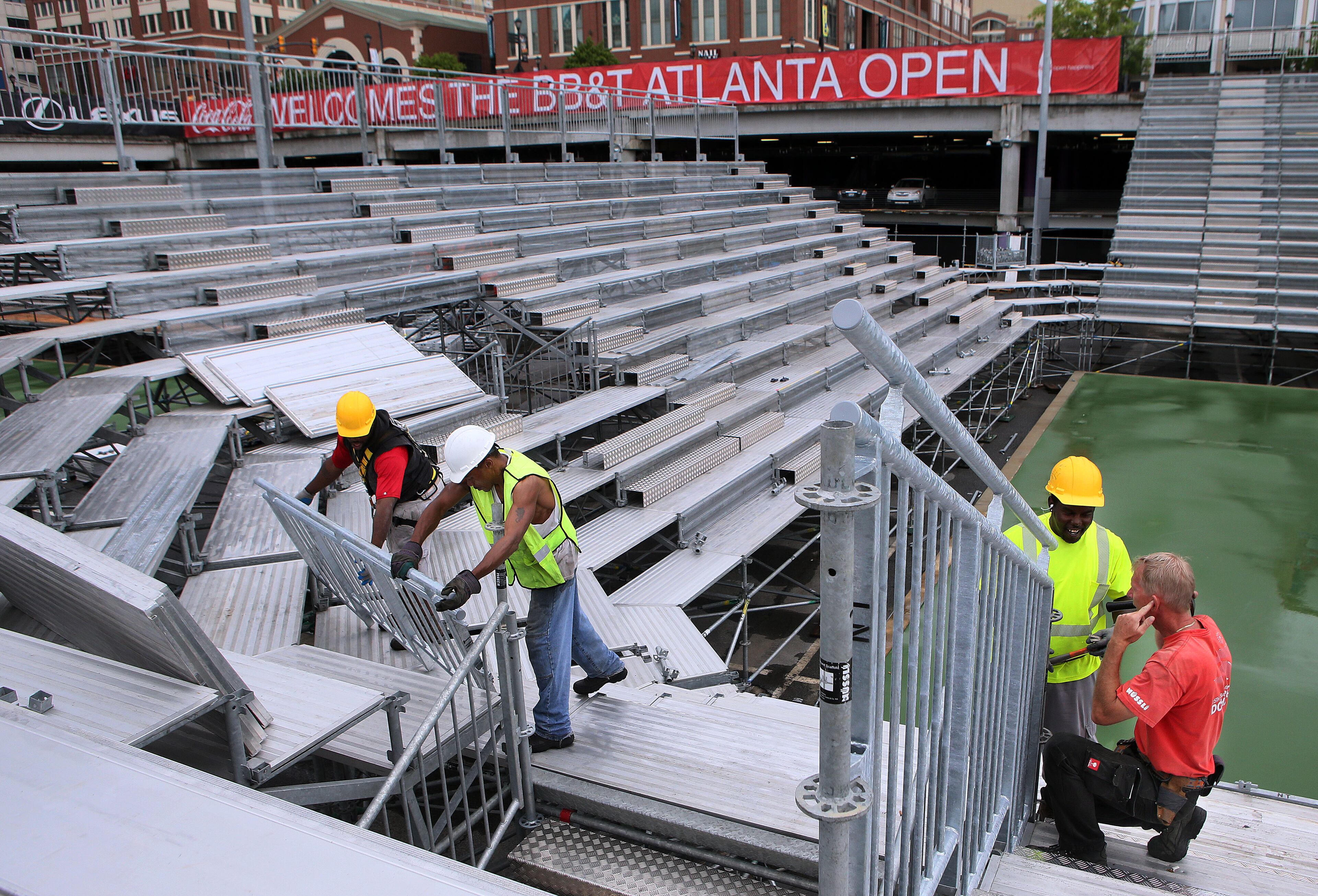 JULY 5, 2013-ATLANTA: Crews construct the grand stands for the upcoming BB&T Atlanta Open men's pro tennis event at Atlantic Station in Atlanta on Friday July 5th, 2013. PHIL SKINNER / PSKINNER@AJC.COM