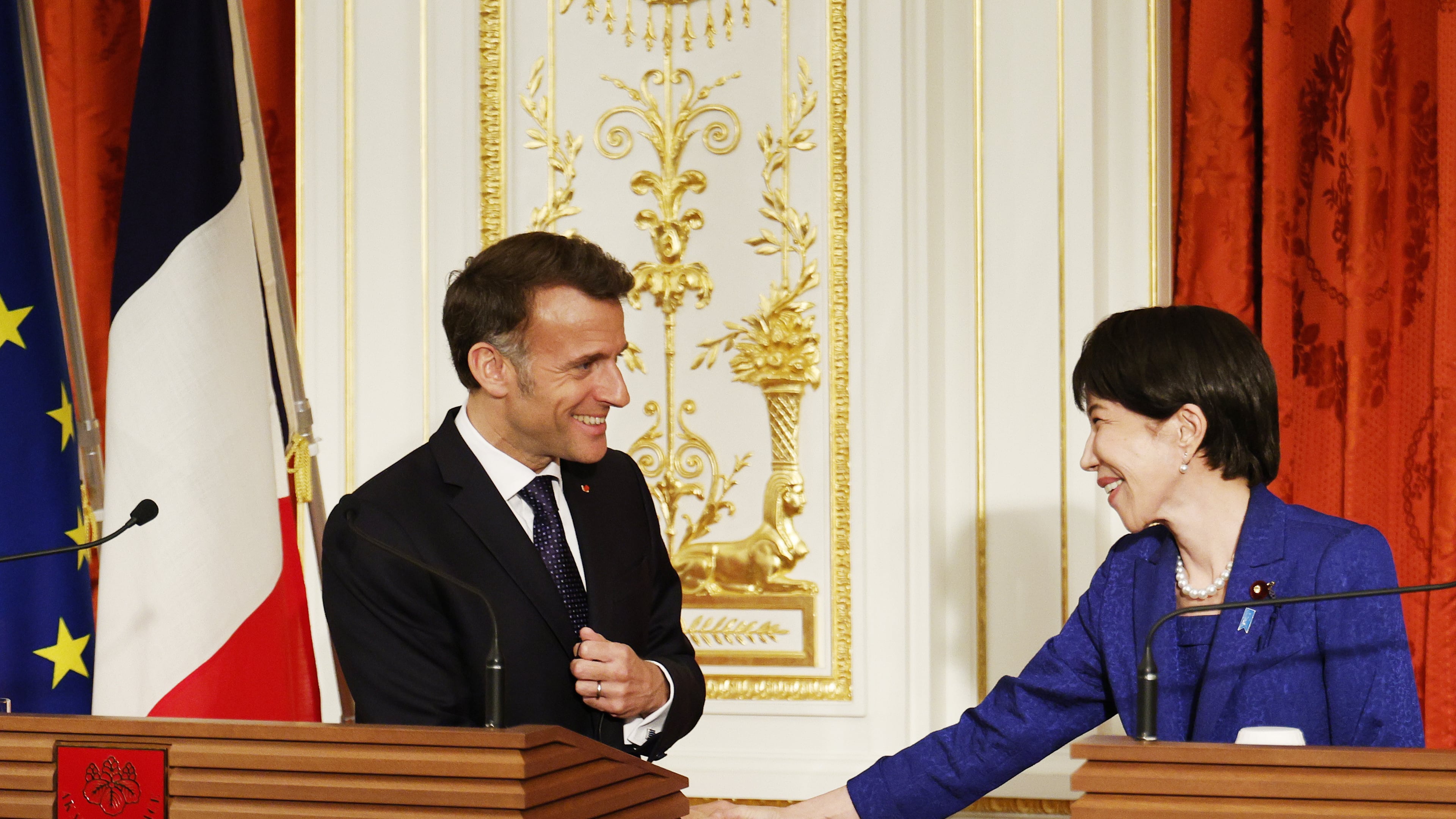 French President Emmanuel Macron, left, and Japanese Prime Minister Sanae Takaichi shake hands during a joint press conference at the Akasaka Palace state guest house in Tokyo Wednesday, April 1, 2026. (Franck Robichon/Pool Photo via AP)